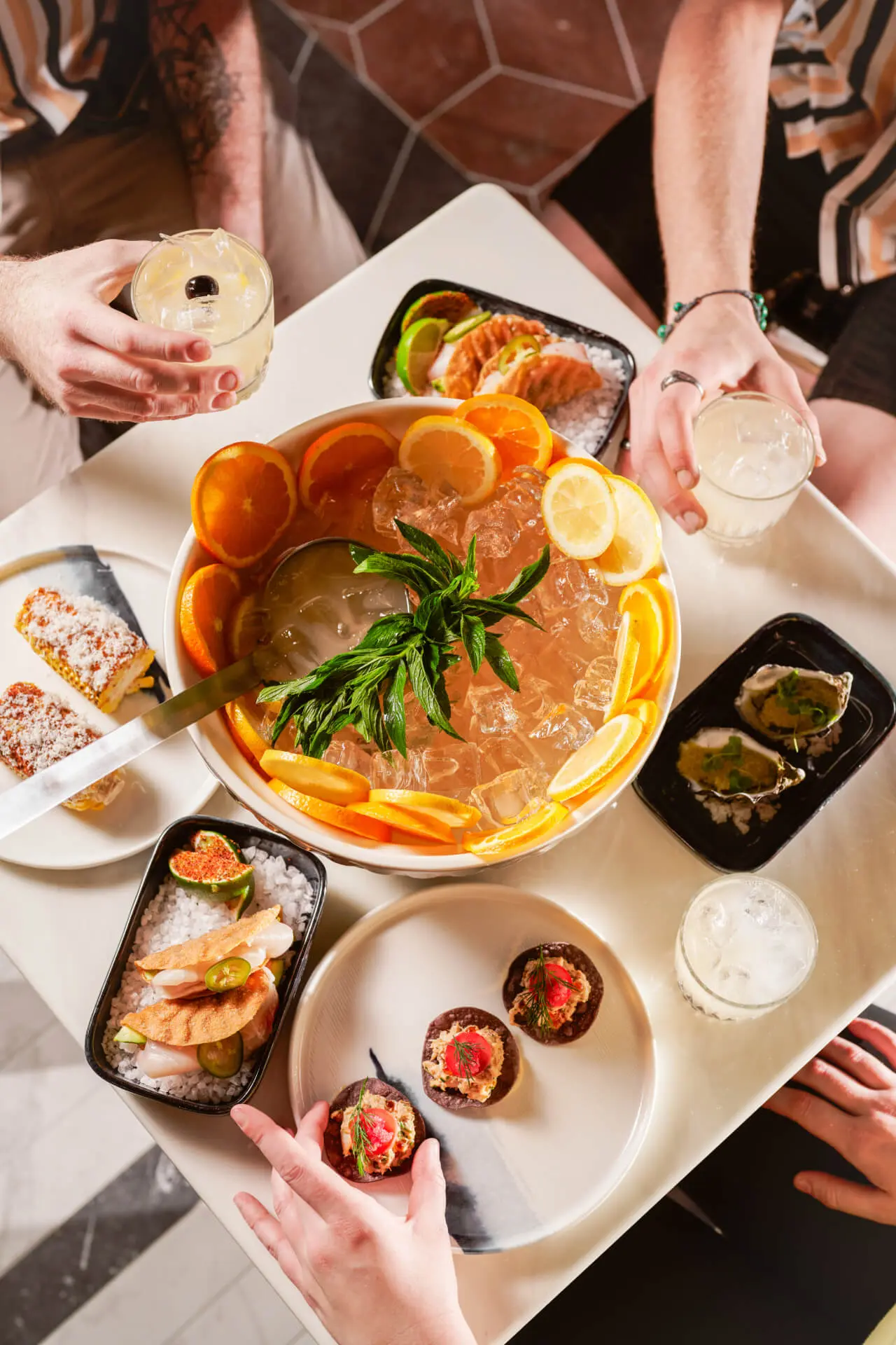 Punch bowl on table with food