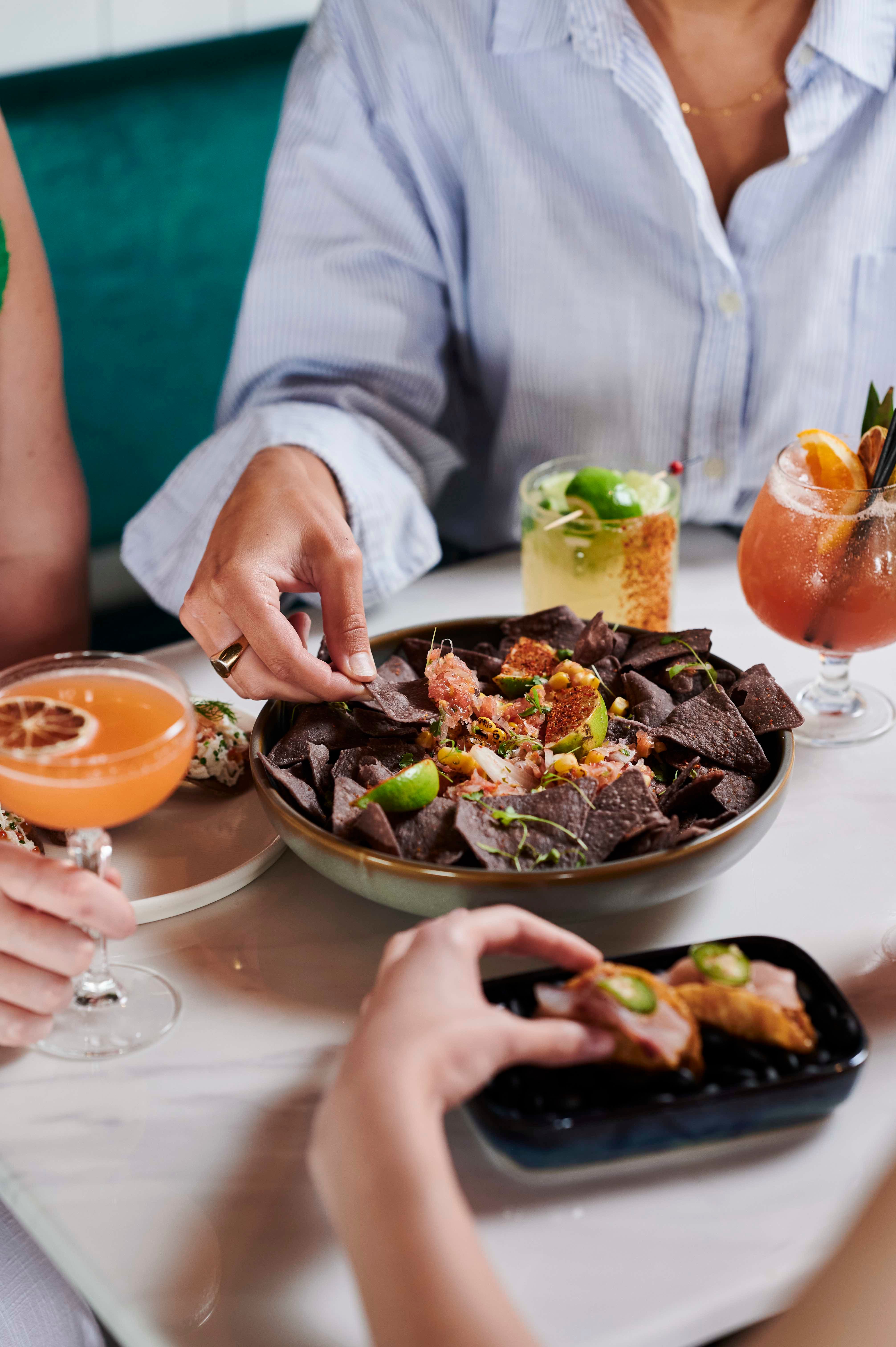 Food and cocktails on table