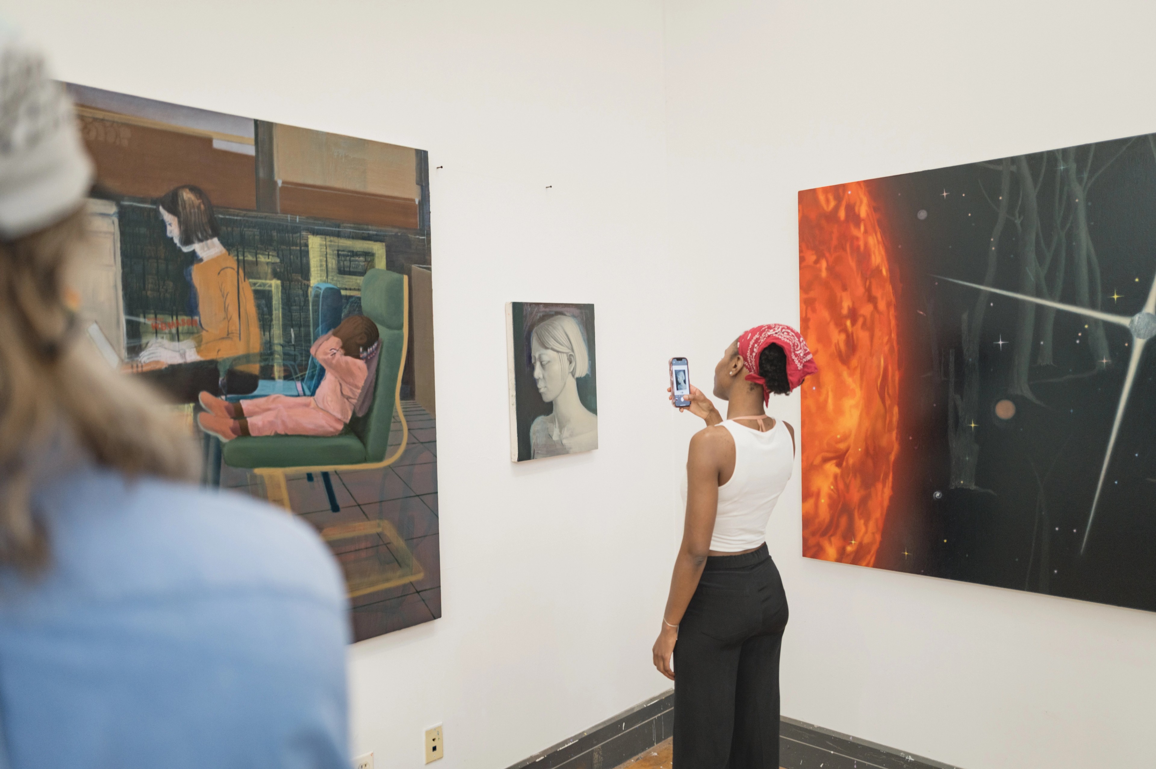 Woman viewing art in a gallery