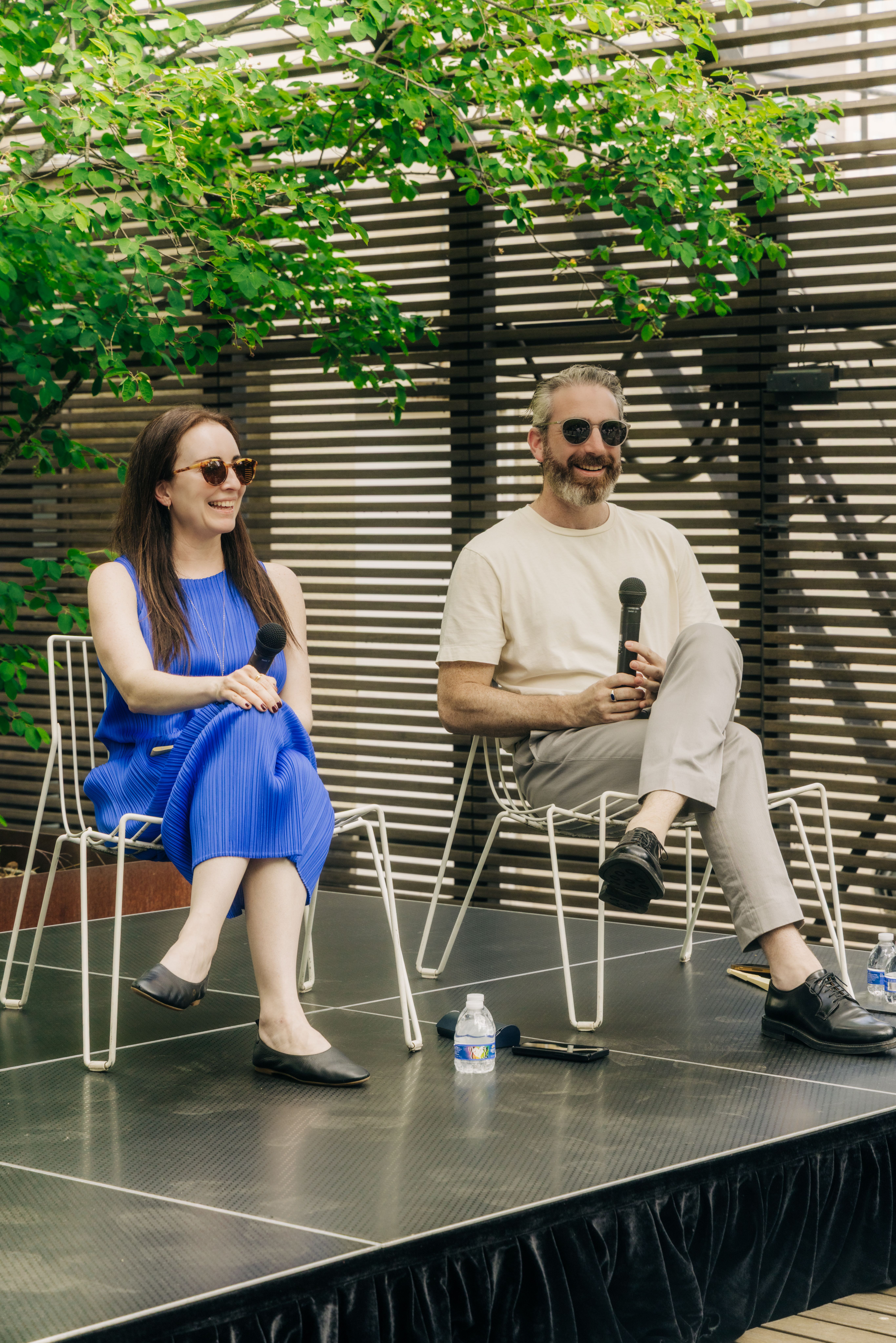 Leaders from Peterson Rich architecture firm seated on a stage