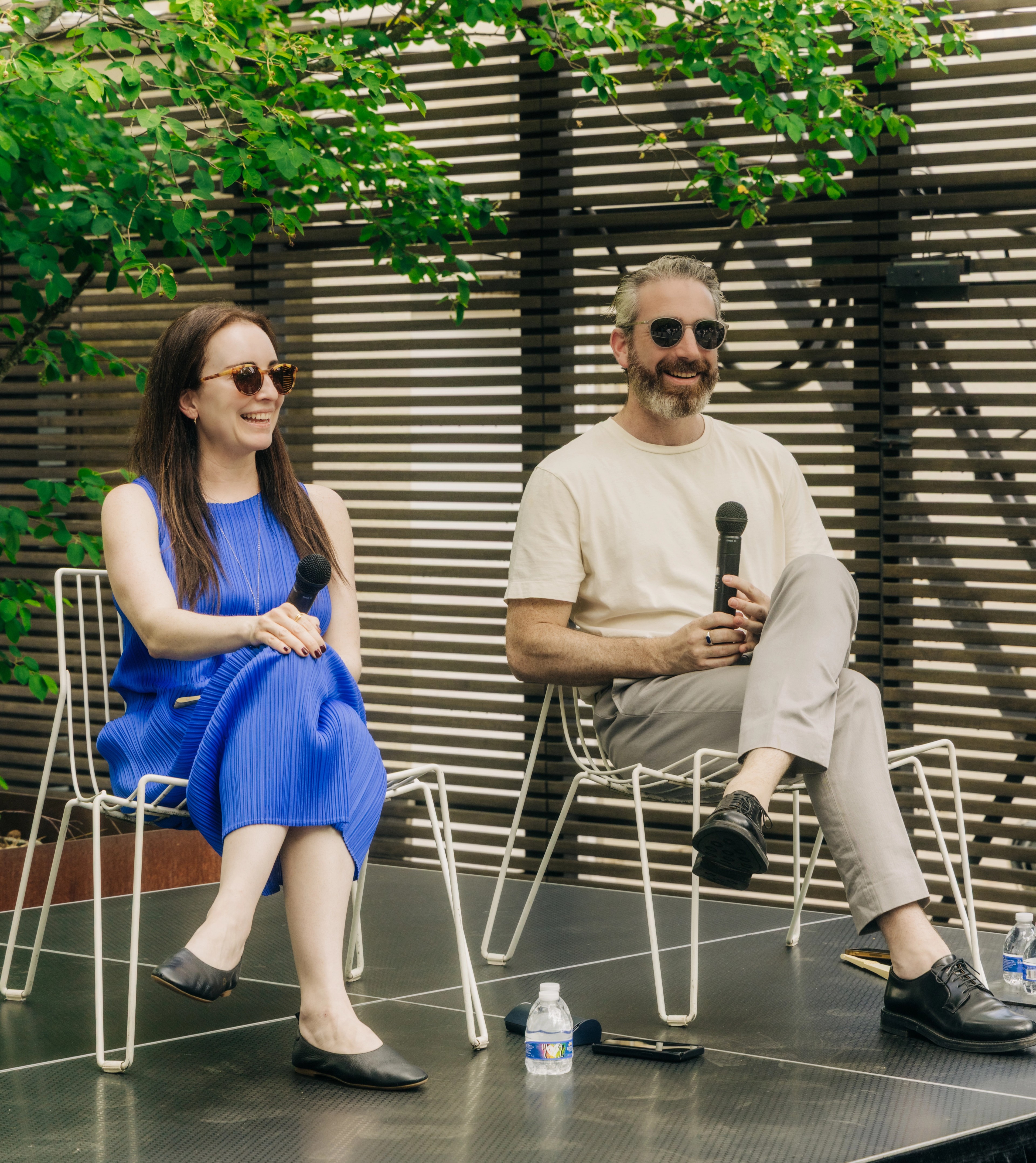 Leaders from Peterson Rich architecture firm seated on a stage
