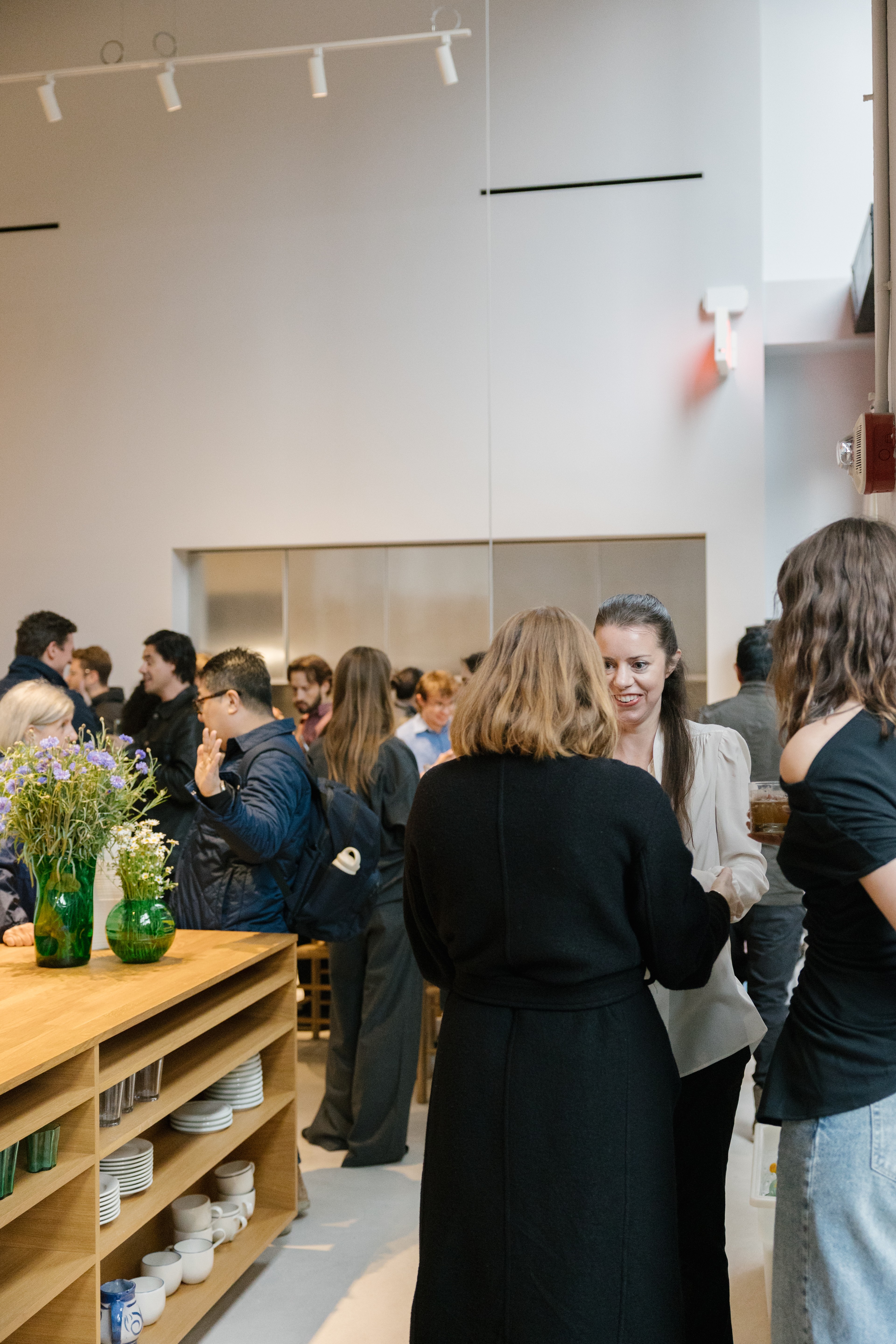 People socializing at reform kitchen party