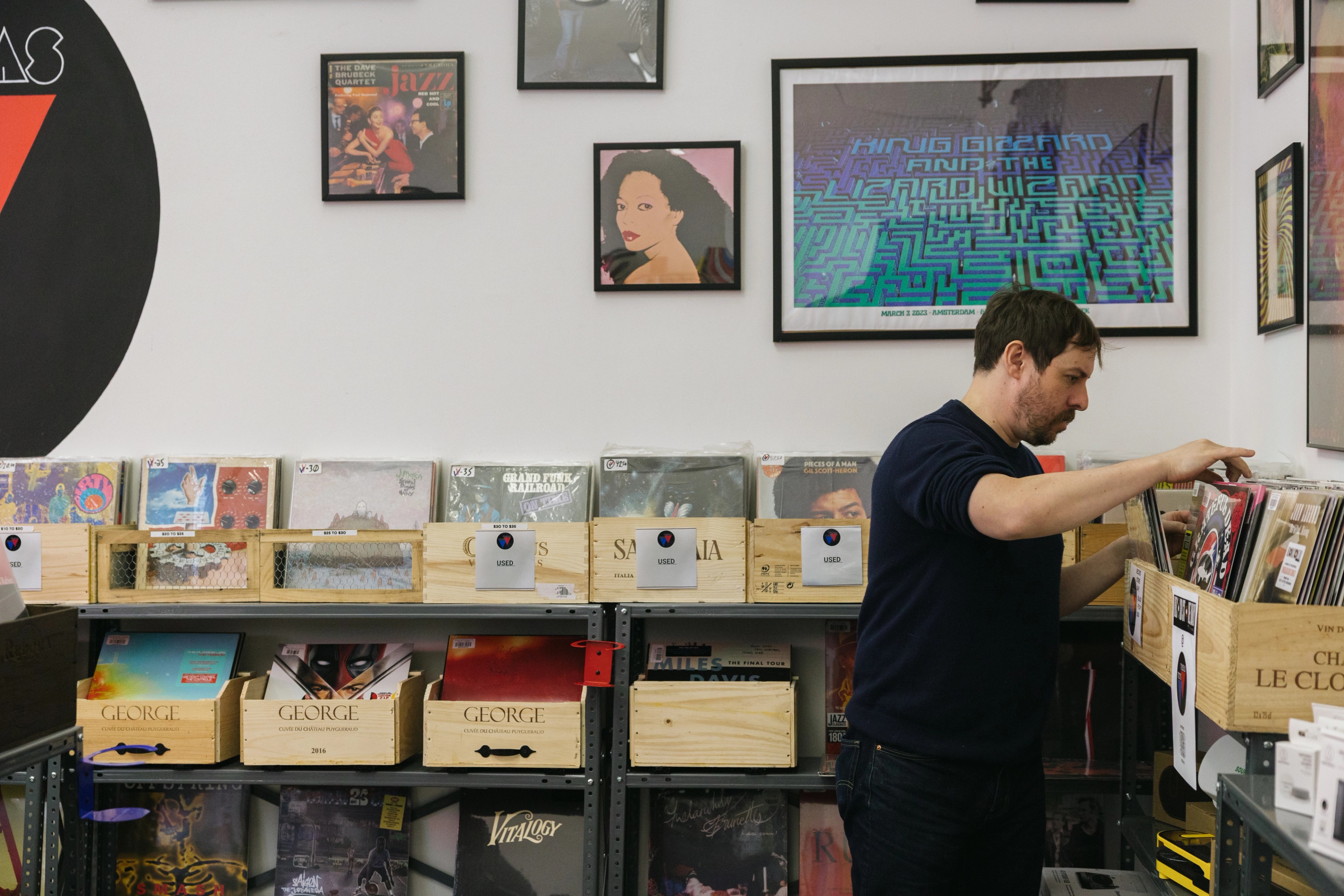 man in record store