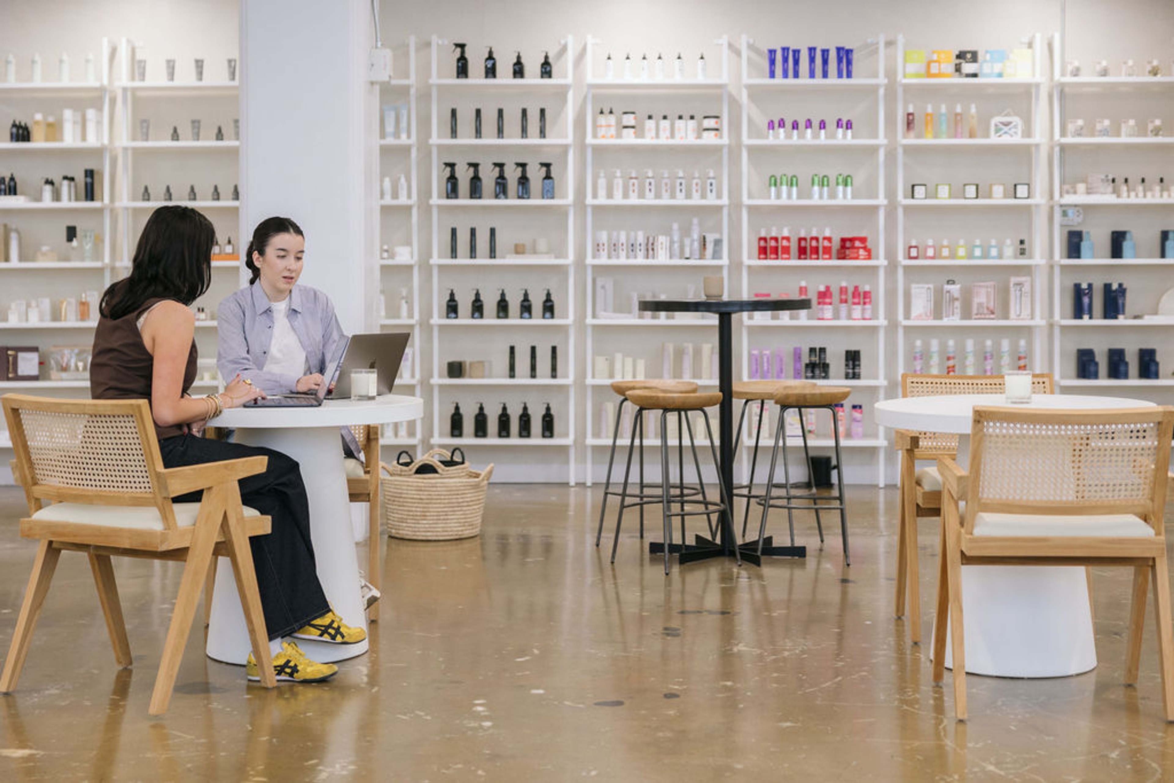 People viewing computer at table in office