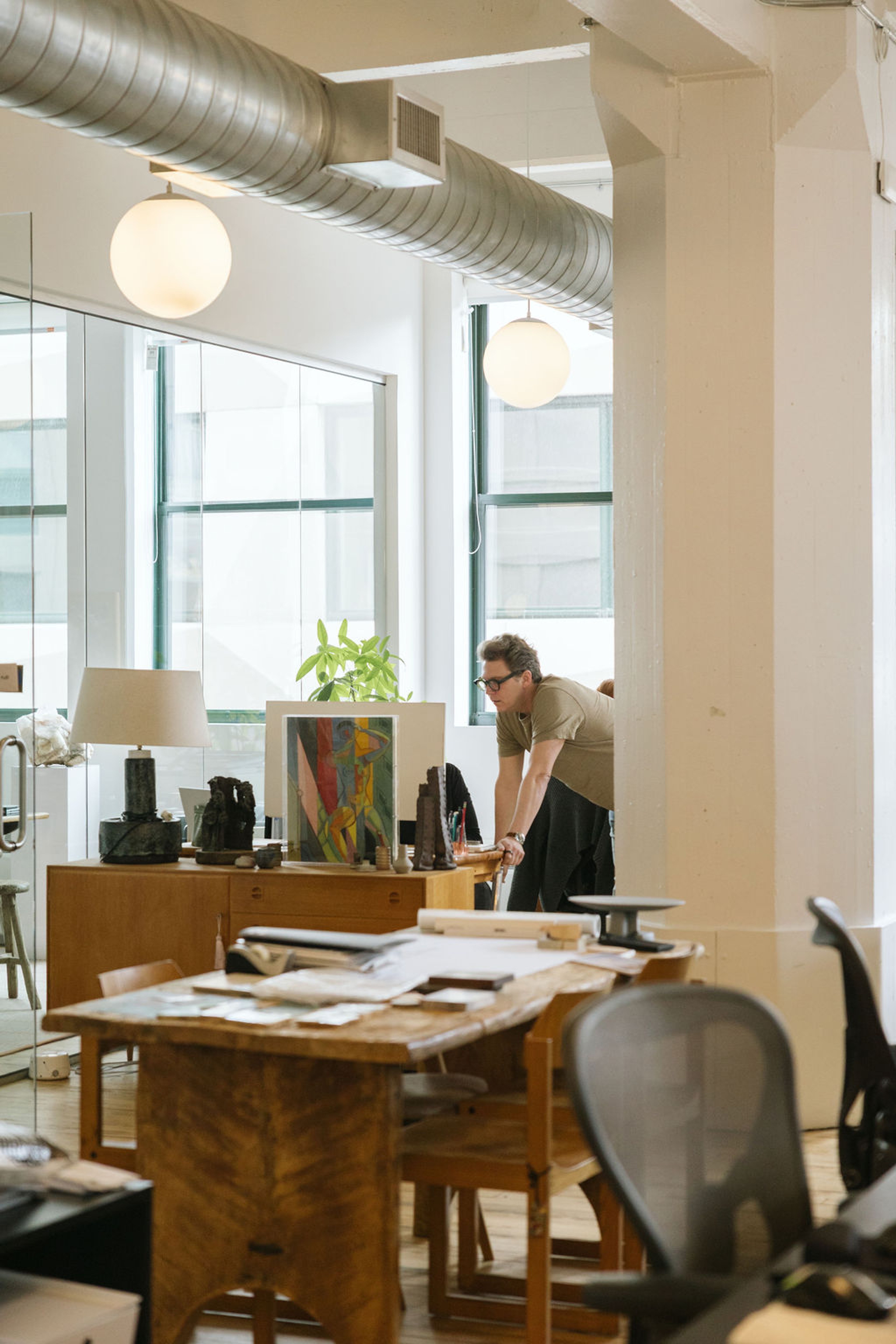 Man reviewing work with colleague