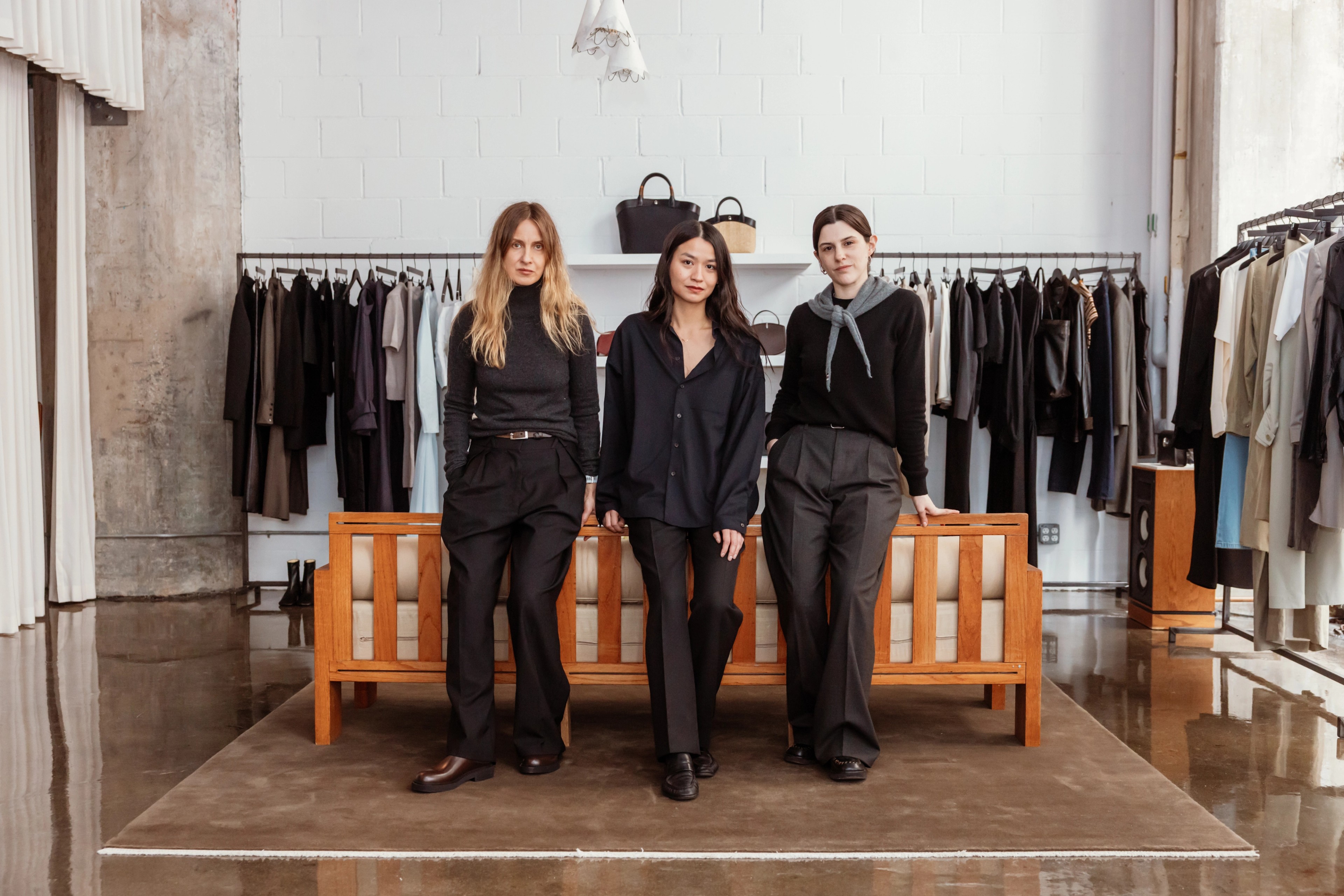 Dawn and her colleagues smiling inside the L'Ensemble store