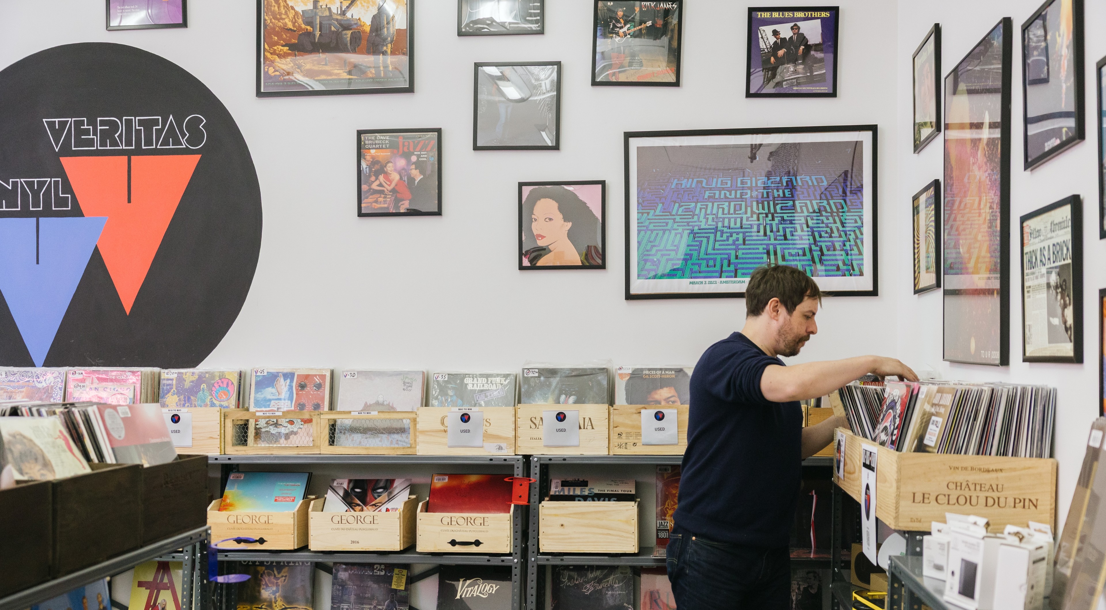 man in record store