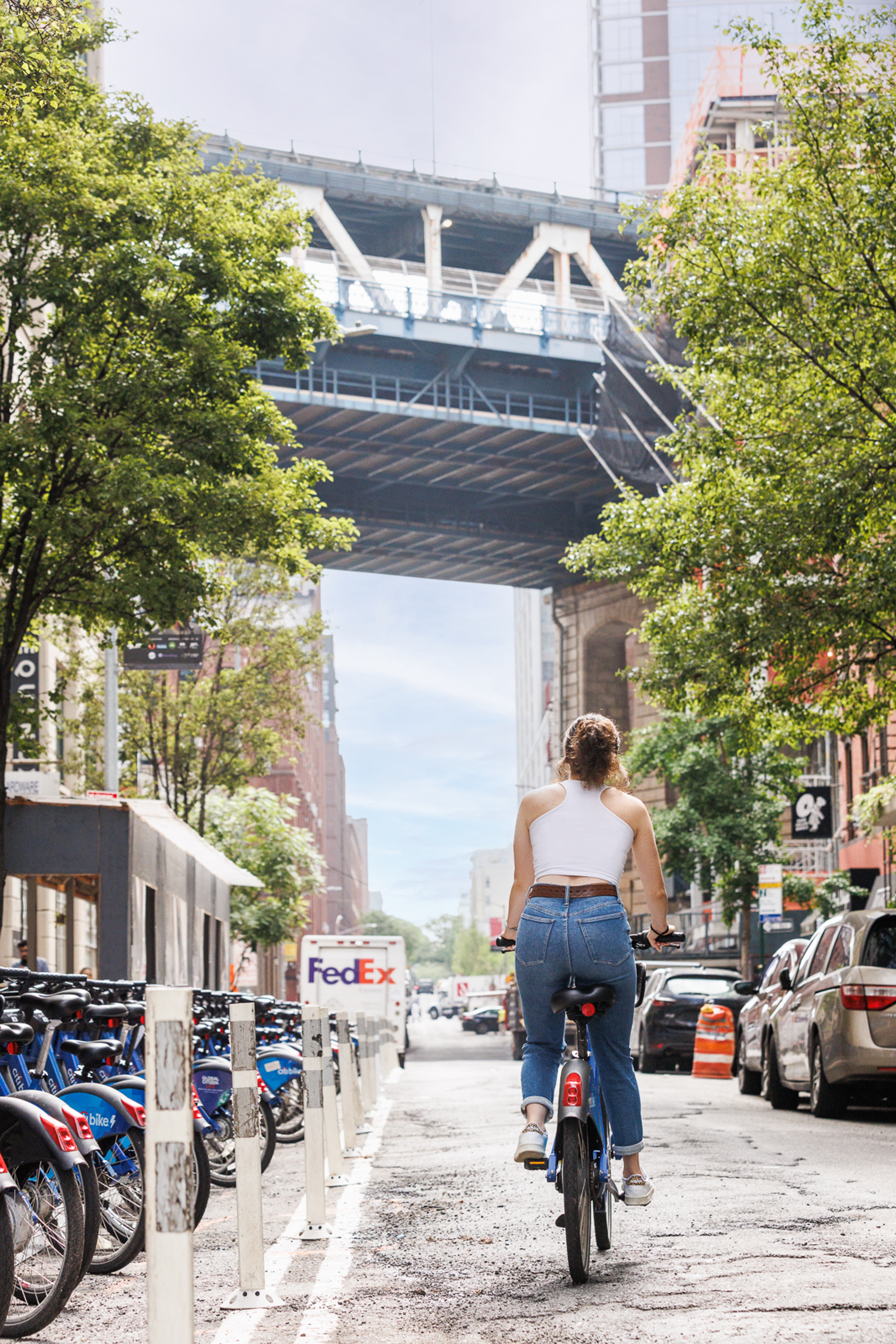 Woman riding Citibike to Brooklyn Office