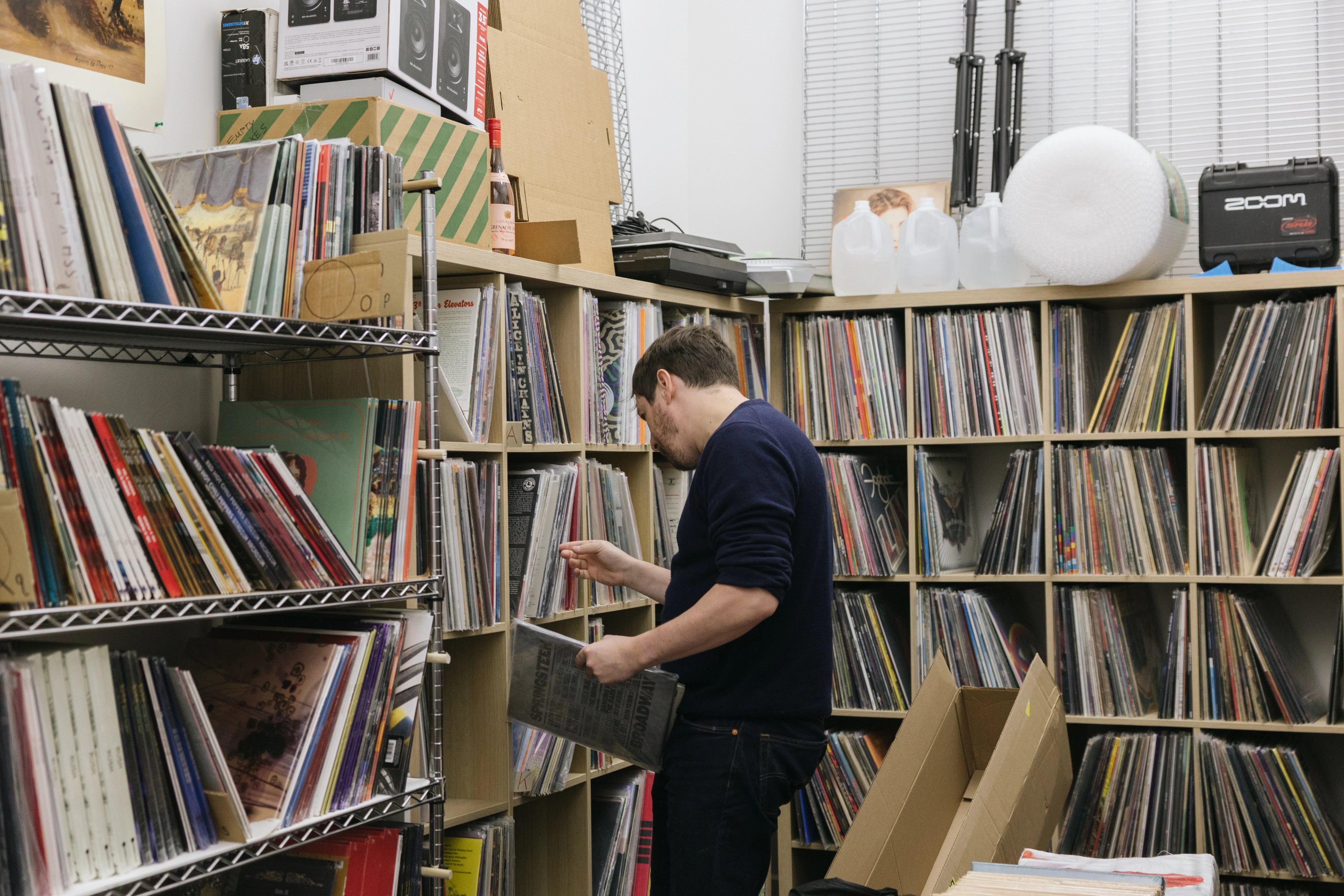 man in record store