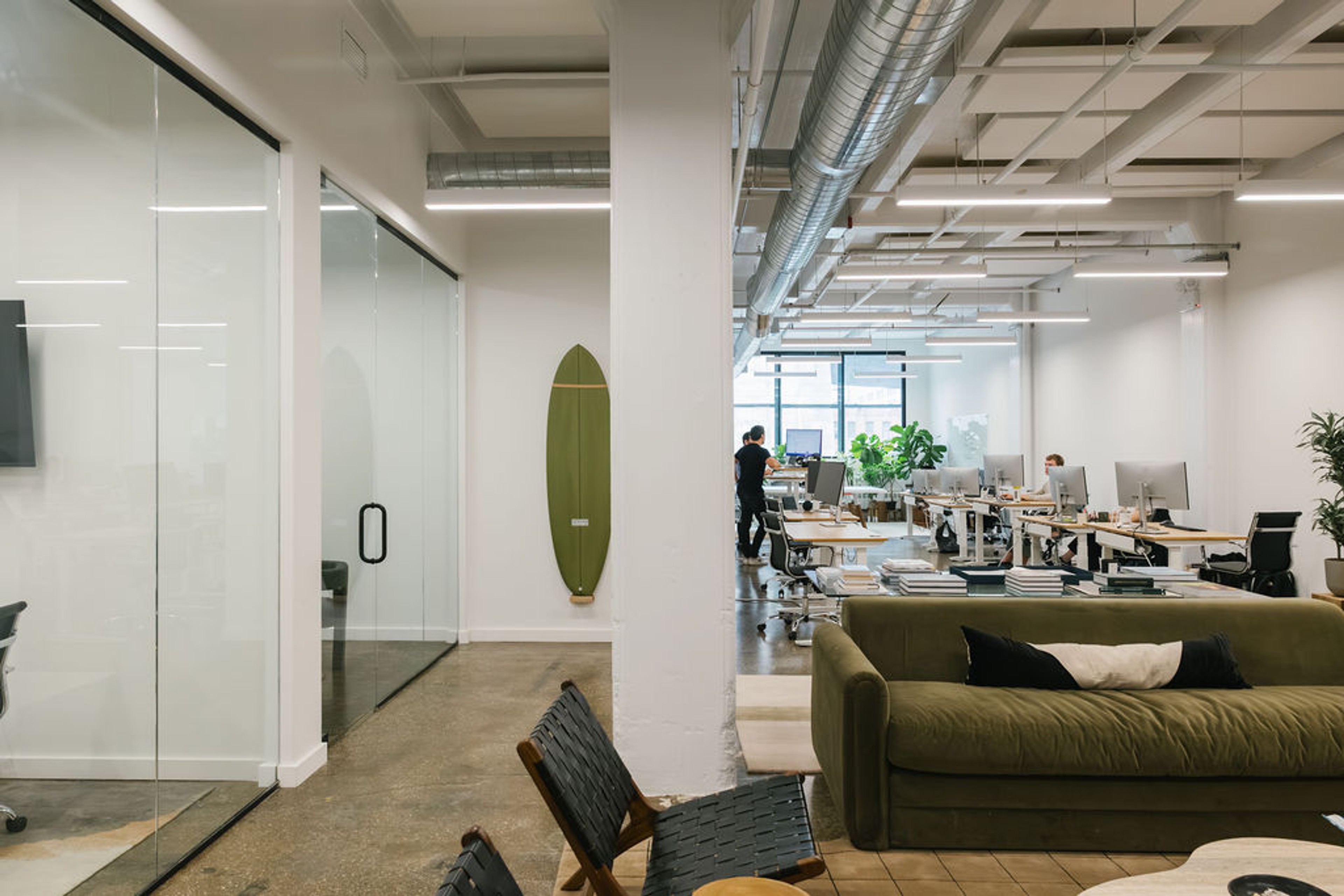 Office with desks, couches and conference rooms