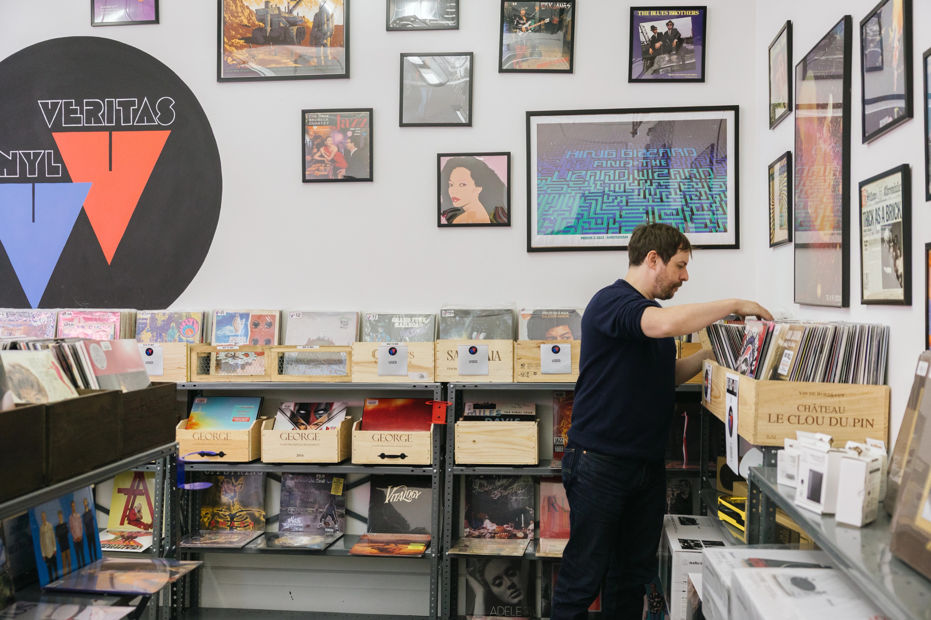 man in an office with vinyls