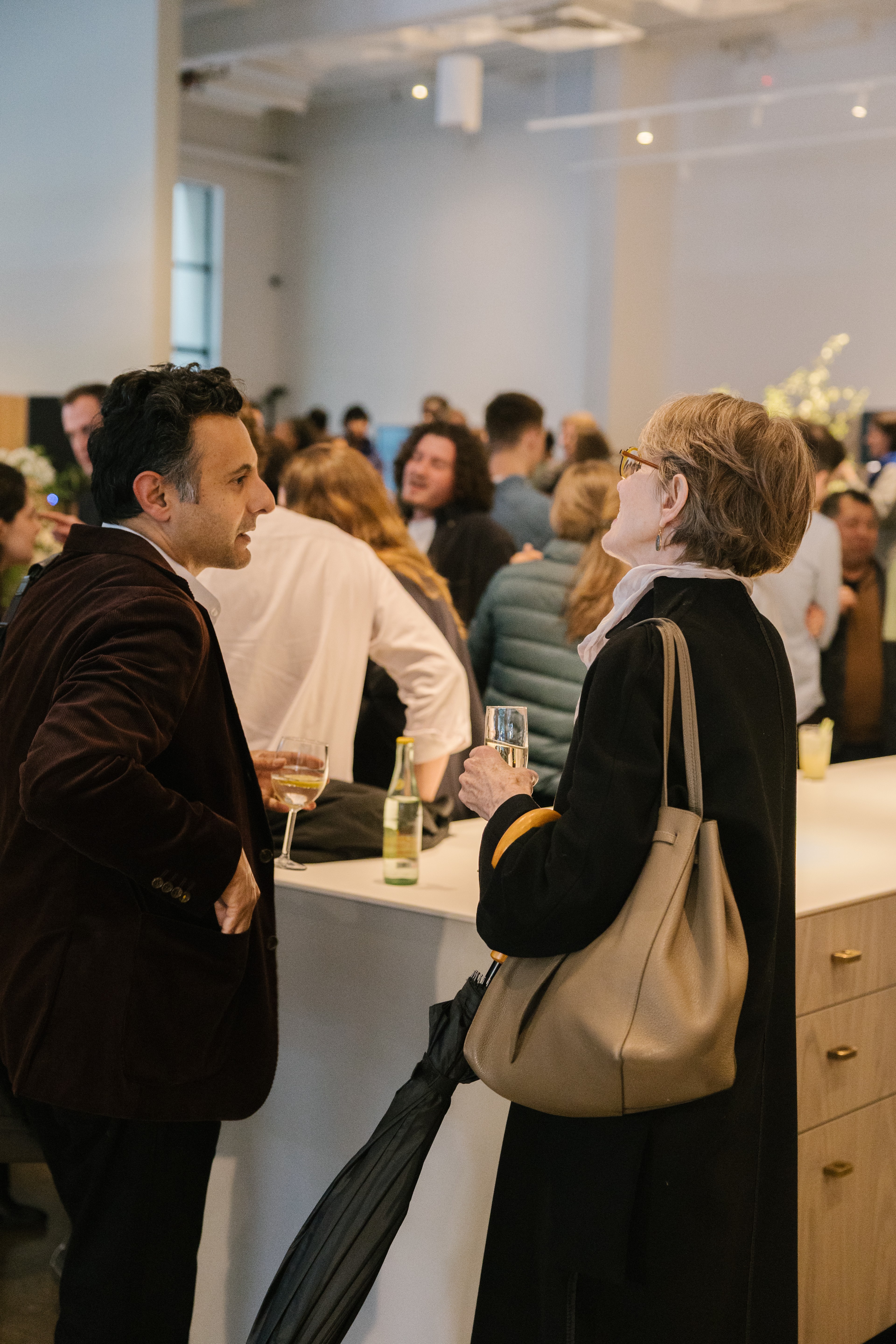 People chatting at a party at Space Theory