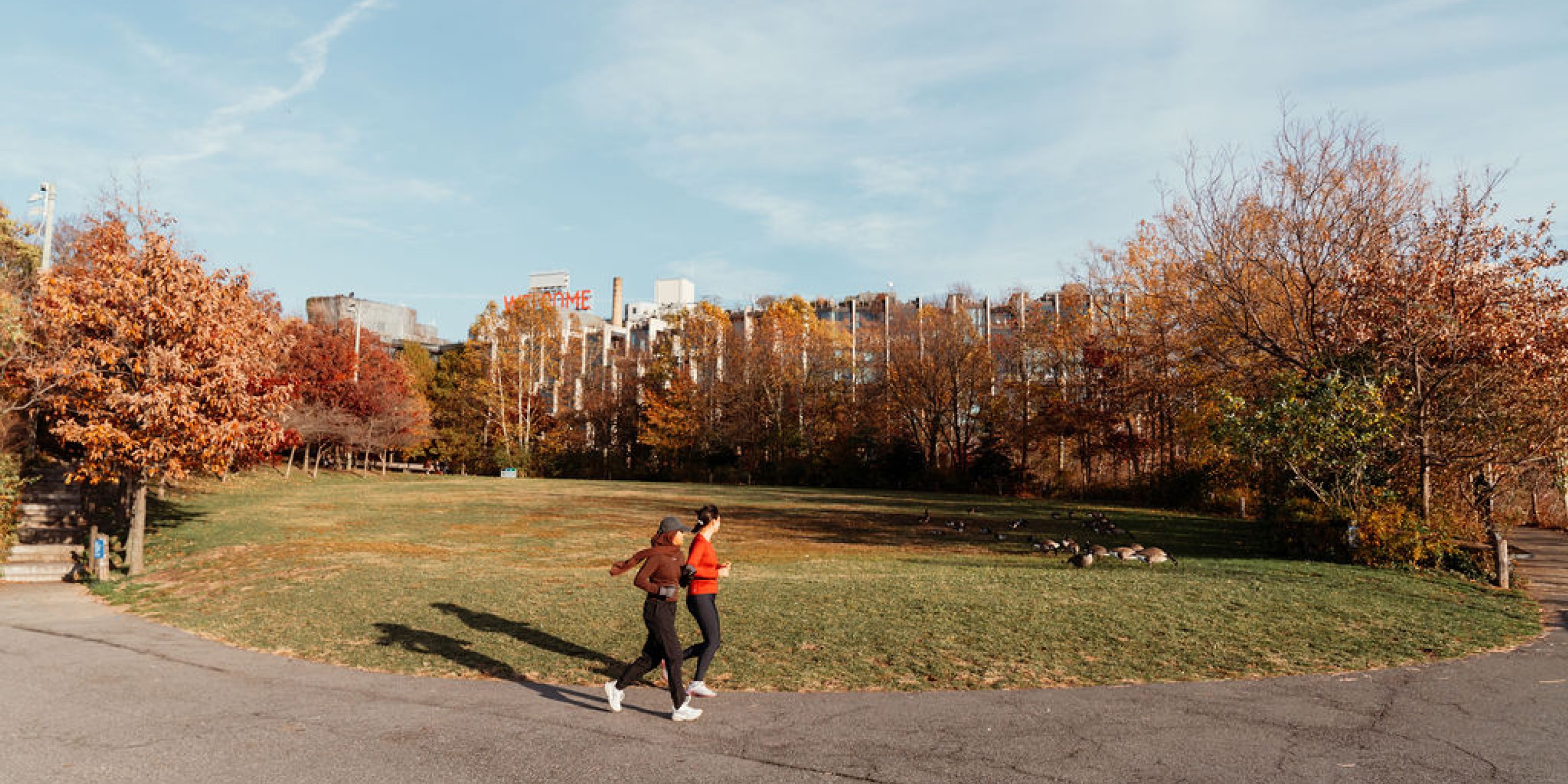 Two women running in the fall in Dumbo Brooklyn