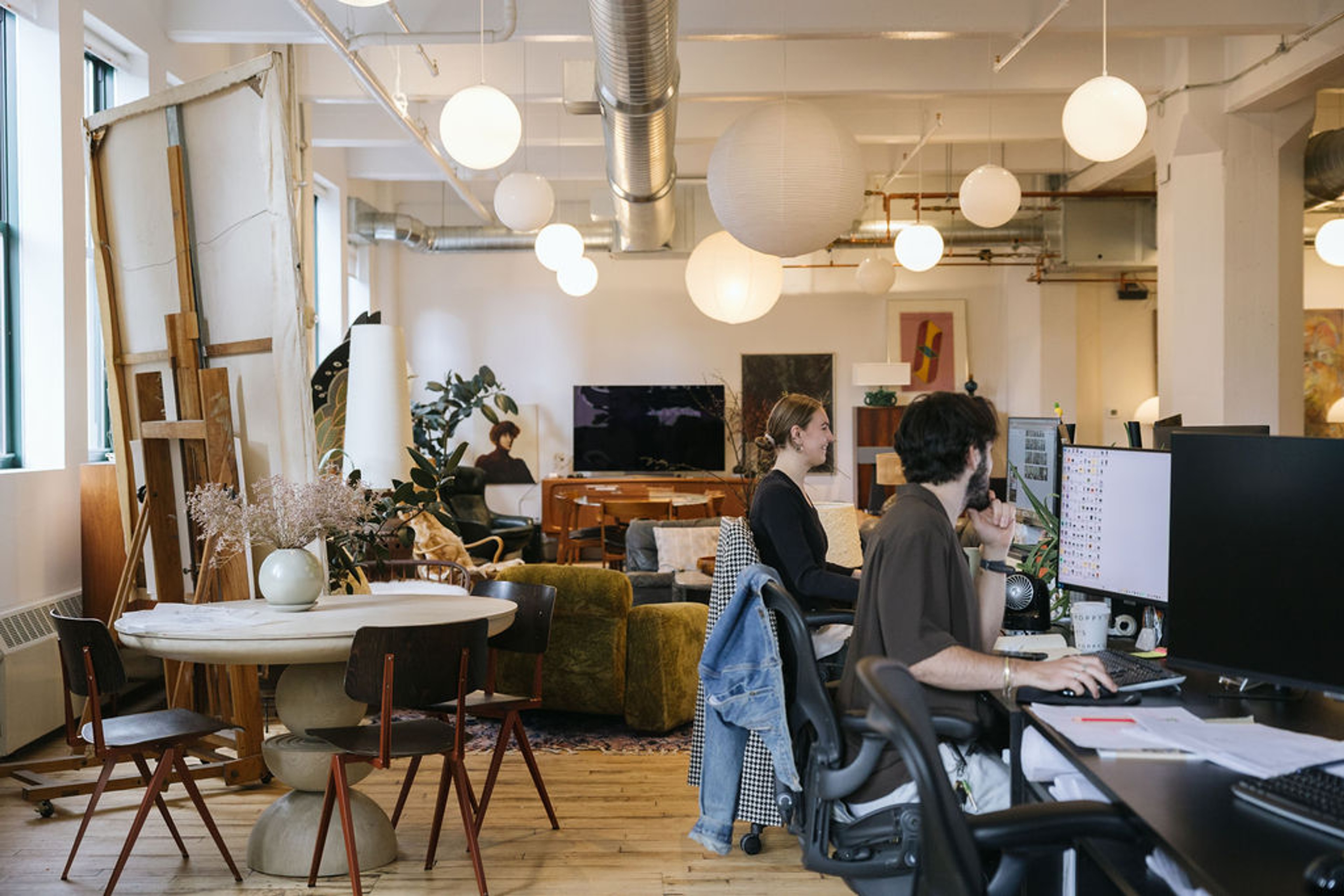 Two people working on computers