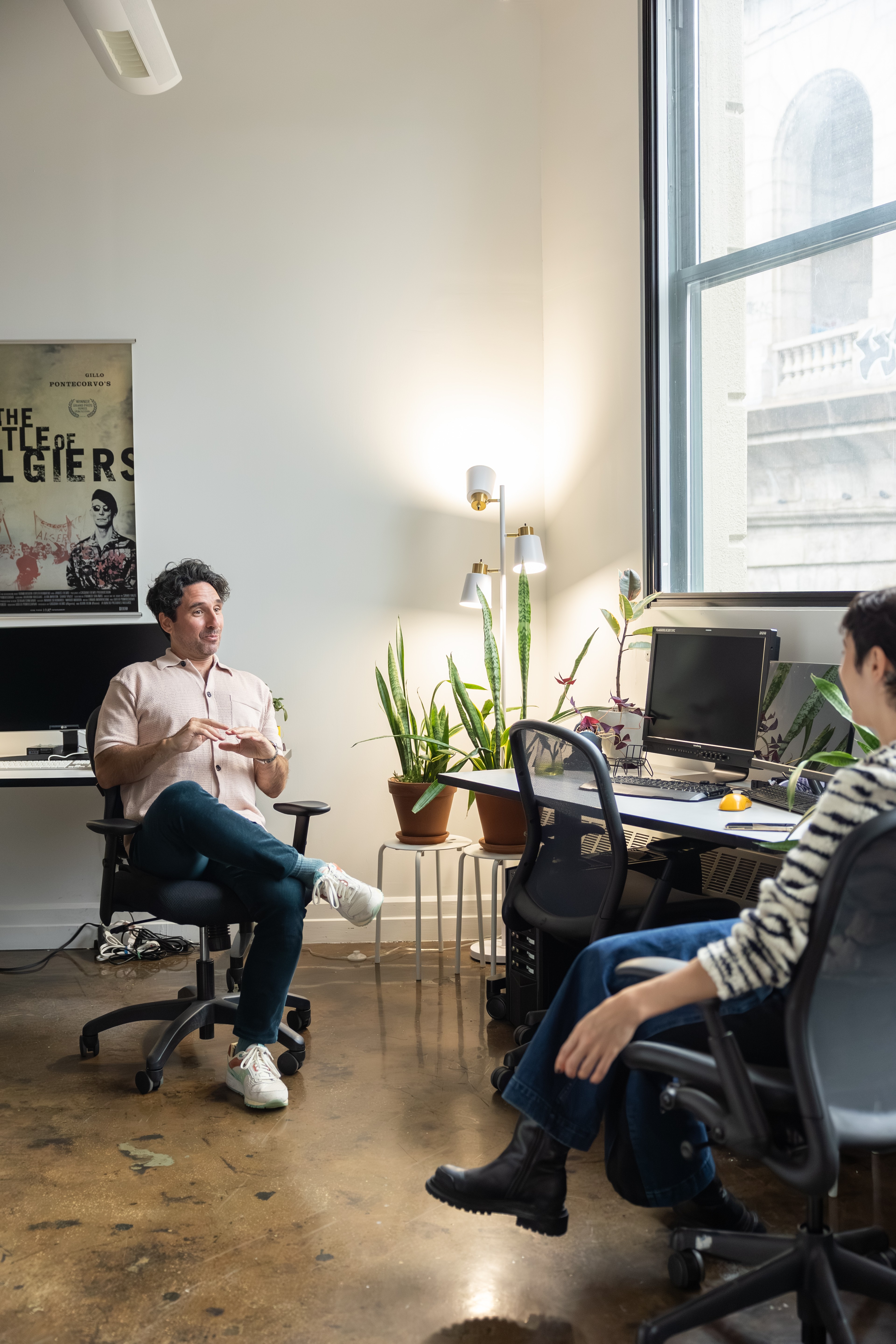 Alex meeting with employee in office