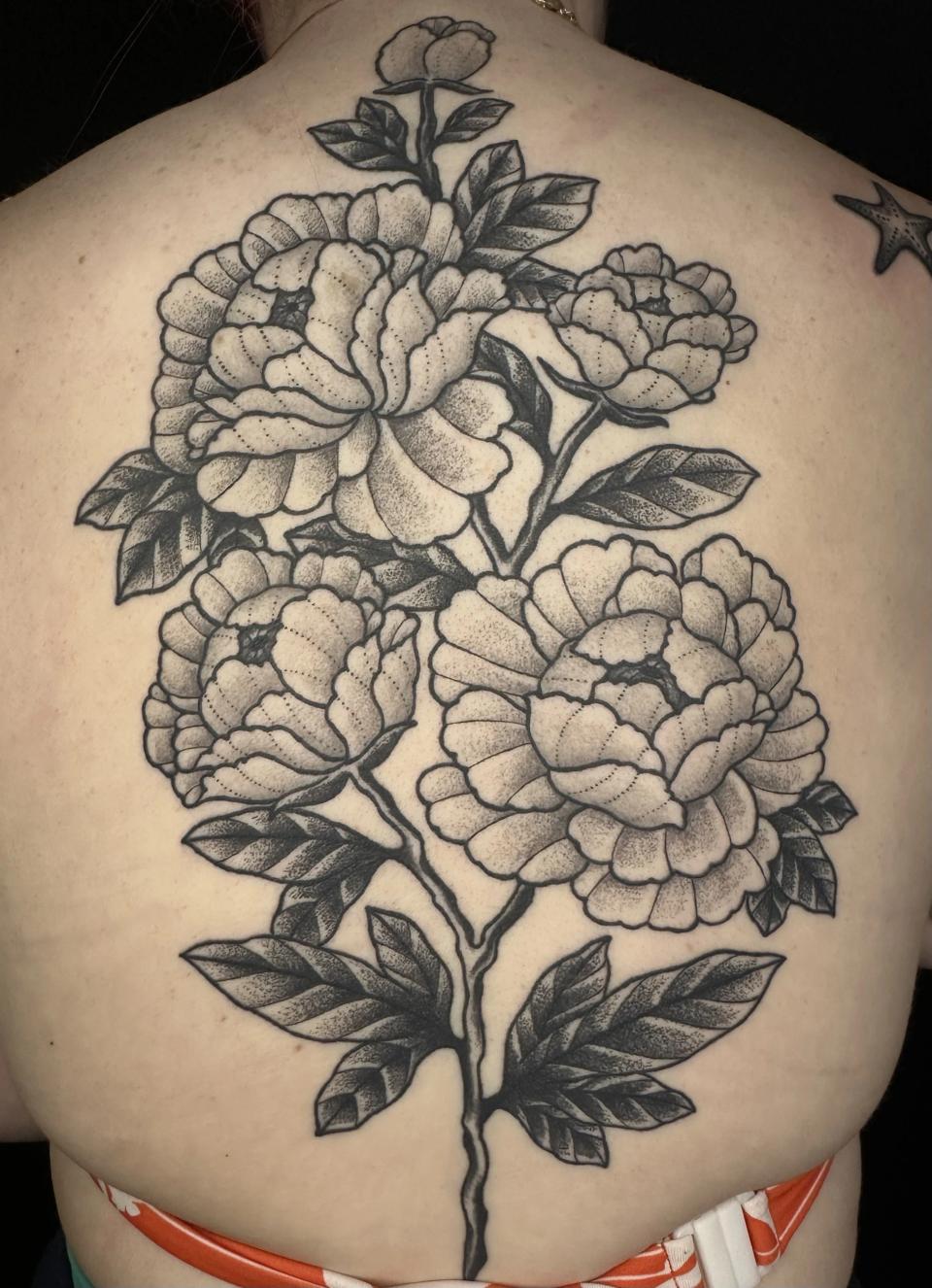 Flower back piece tattoo