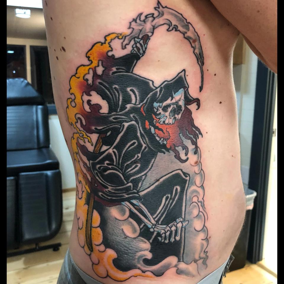Grim reaper side piece tattoo