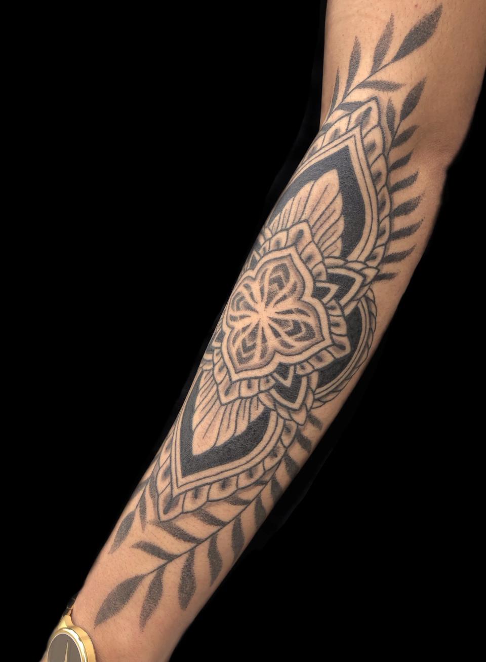 Arm design tattoo