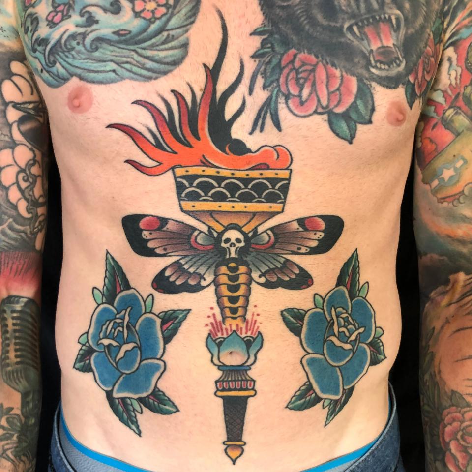 Death's head moth and roses stomach tattoo