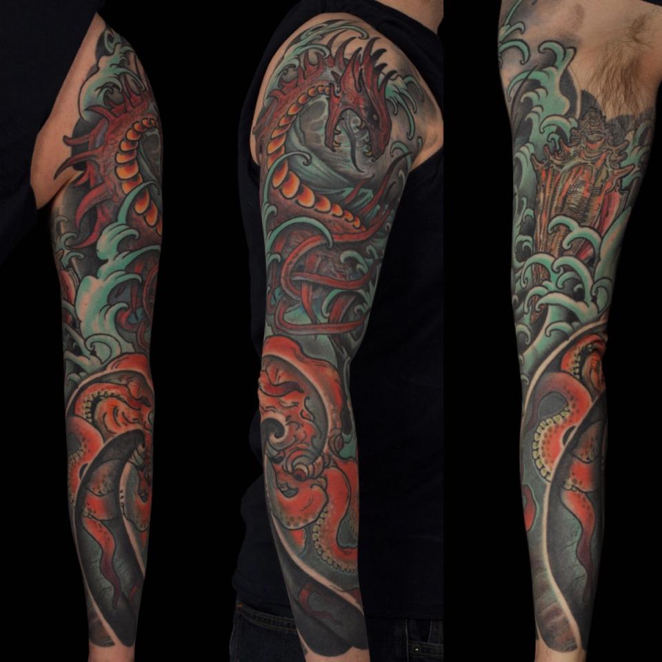 Dragon arm sleeve tattoo