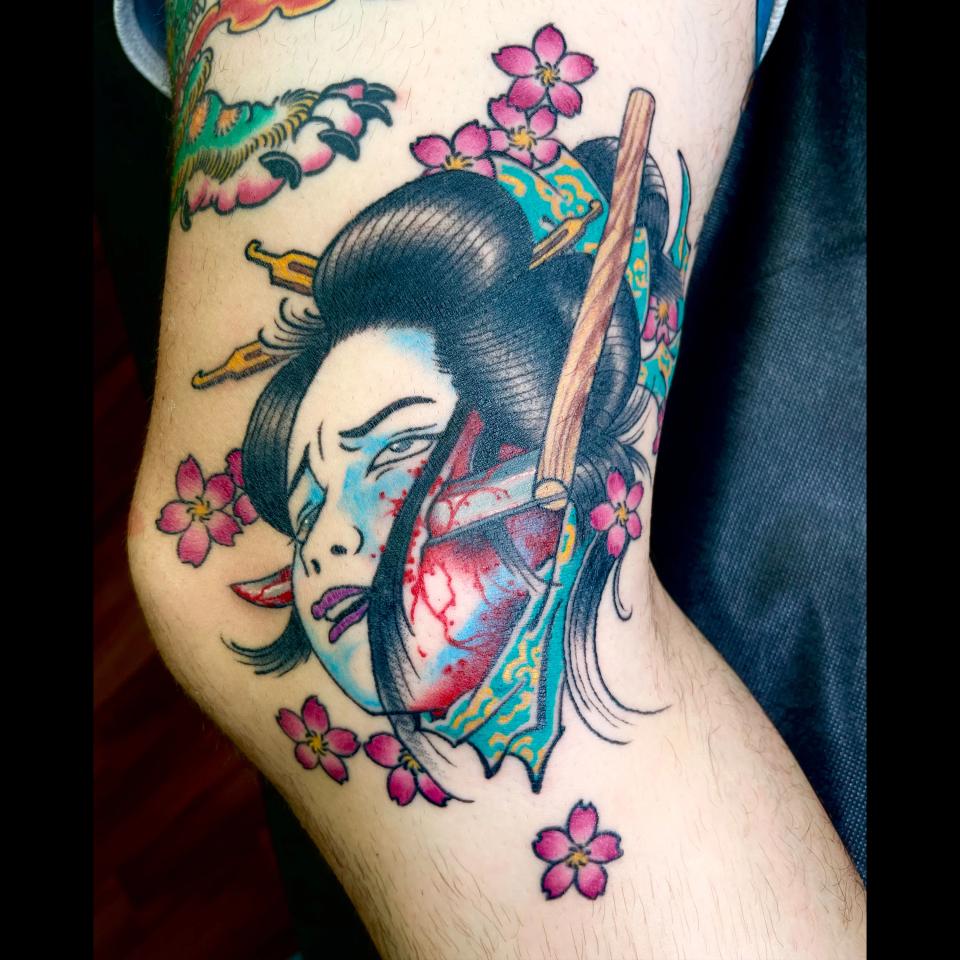 Japanese woman inside knee tattoo