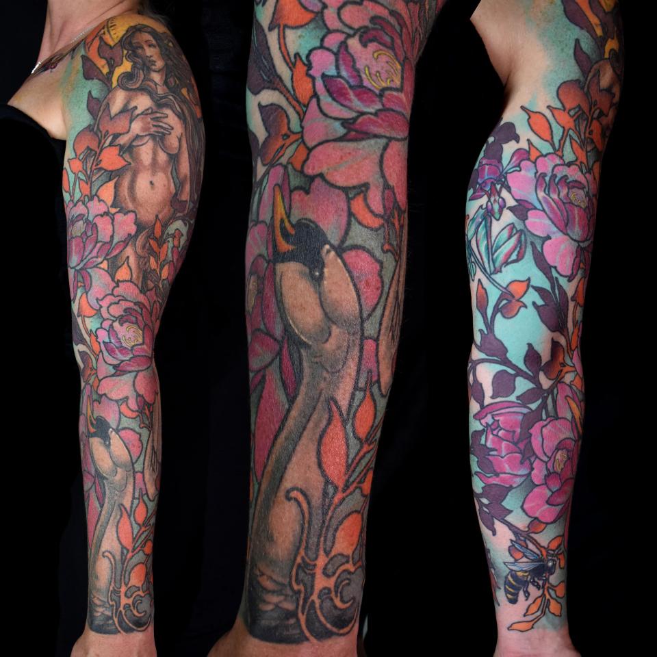 Venus and flowers sleeve tattoo
