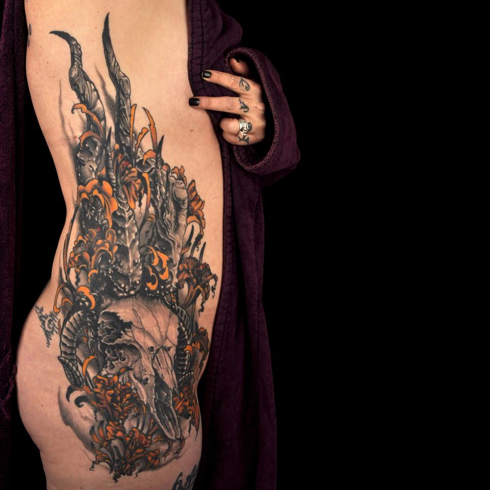 Skull side piece tattoo