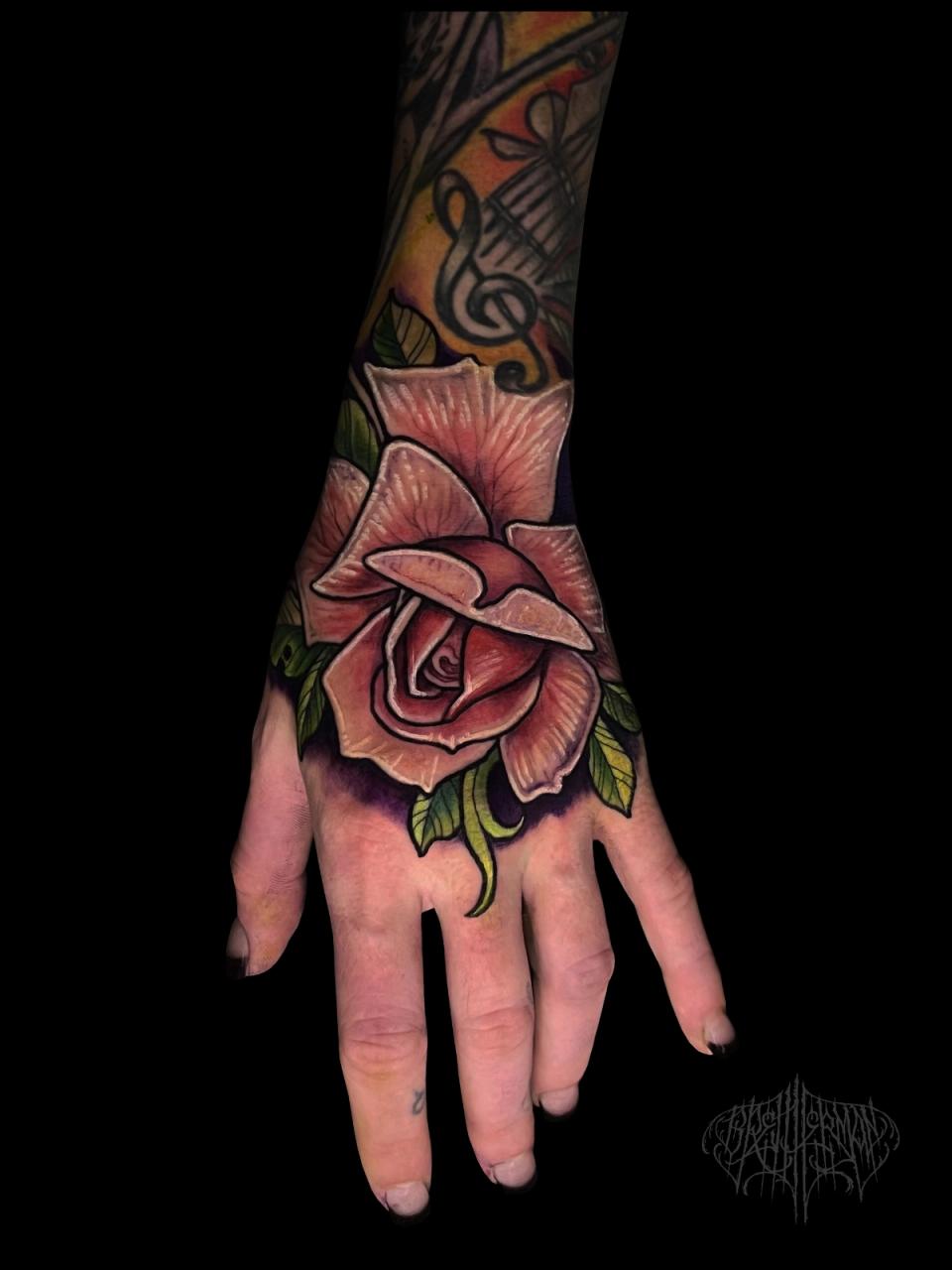 Color rose hand tattoo