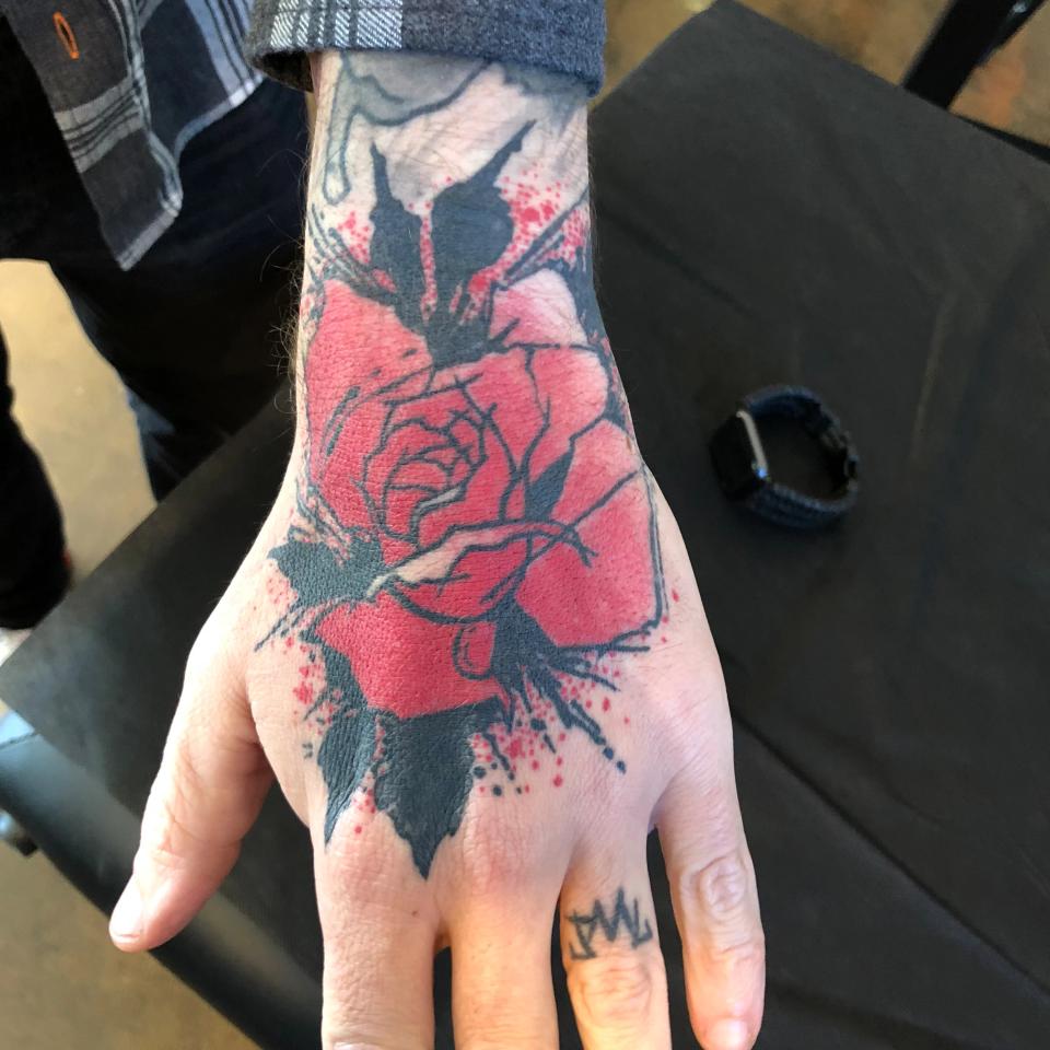 Rose hand tattoo