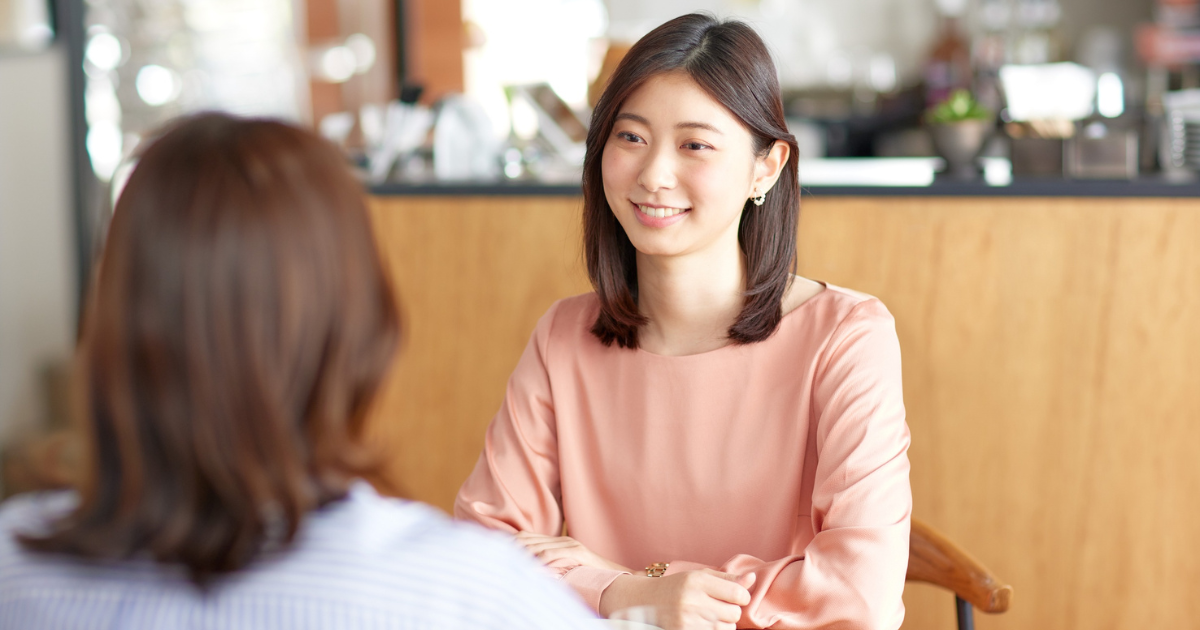 Two women having a conversation.