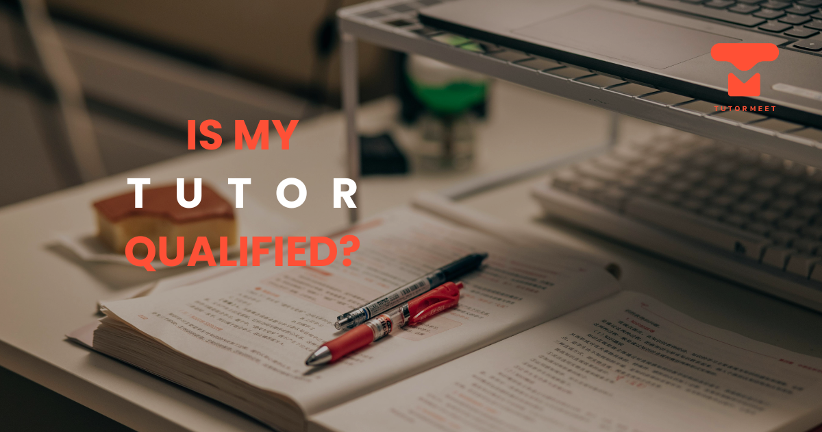 Open textbook with pens on a study table.