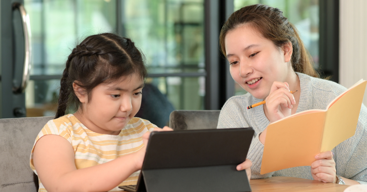 Happy tutor and child.