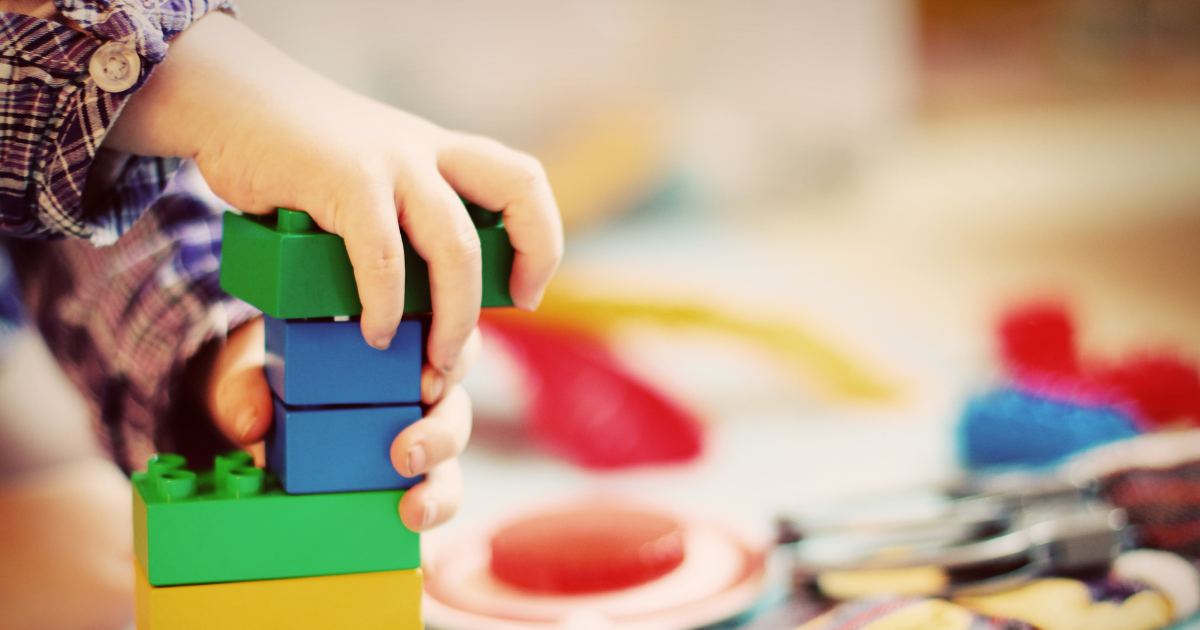Boy playing with blocks.
