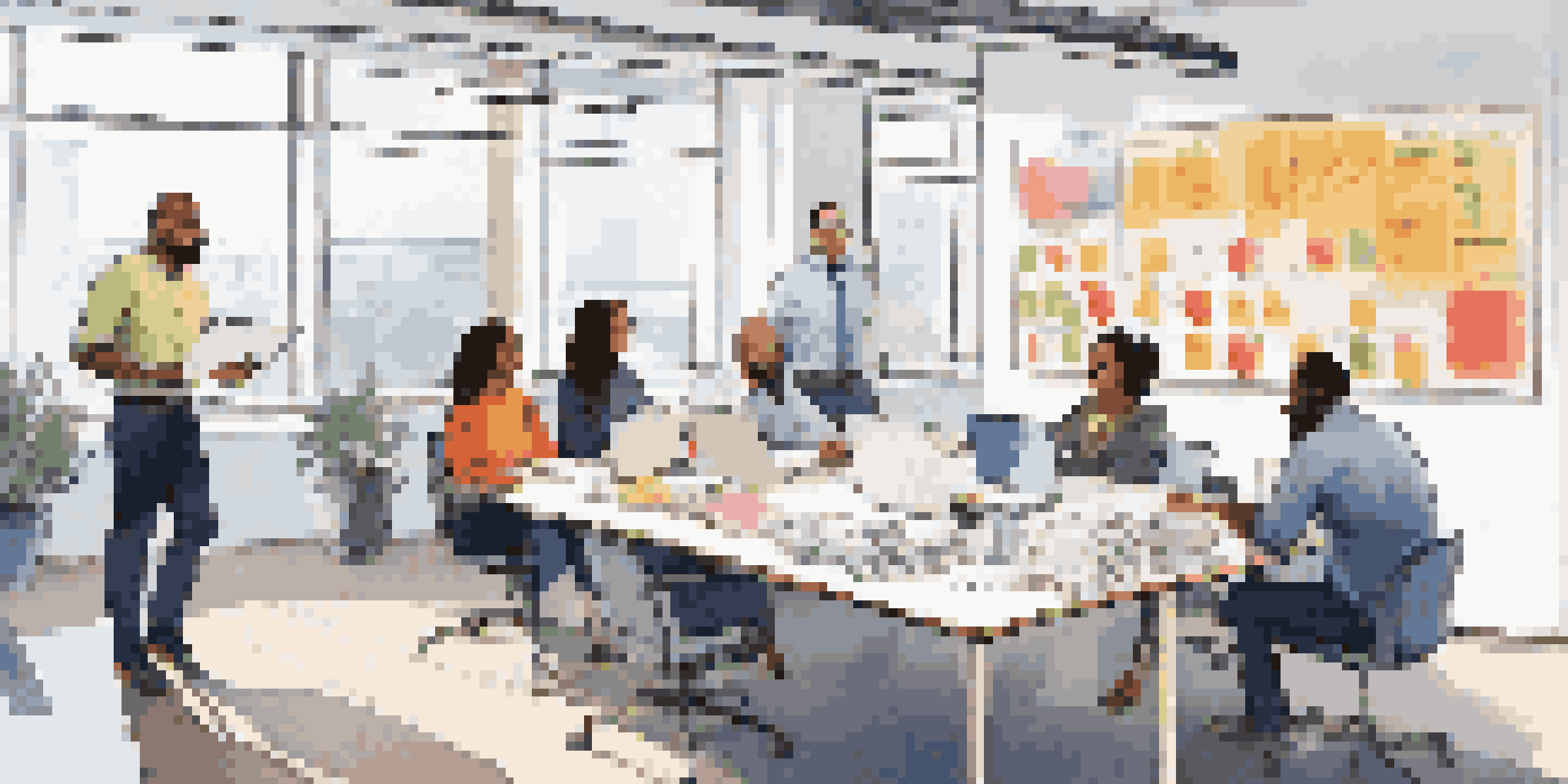 A diverse group of professionals collaborating in a bright, modern office setting, surrounded by laptops and documents, with a whiteboard in the background filled with diagrams.
