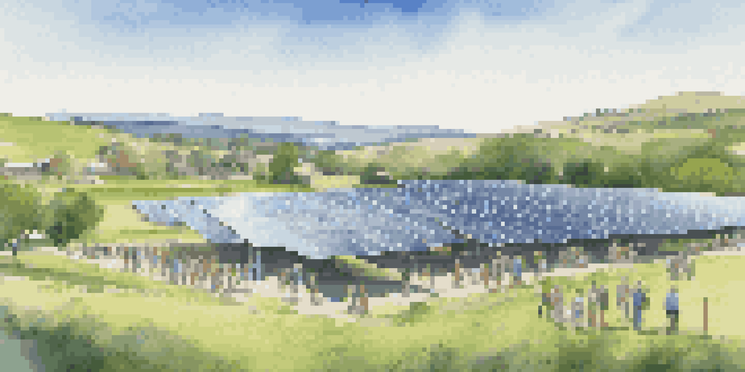 A solar farm with solar panels in a green landscape, and diverse people discussing renewable energy.