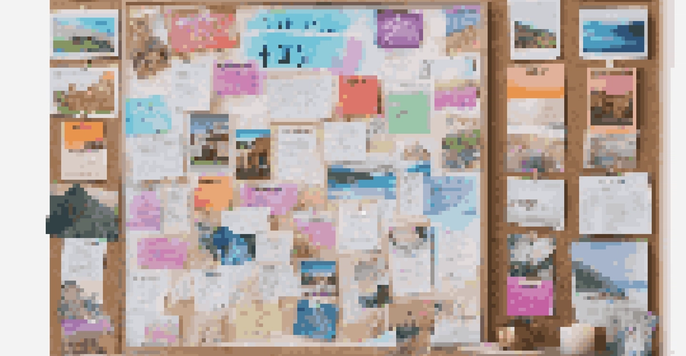 A corkboard filled with colorful images and quotes representing financial goals, illuminated by soft natural light.