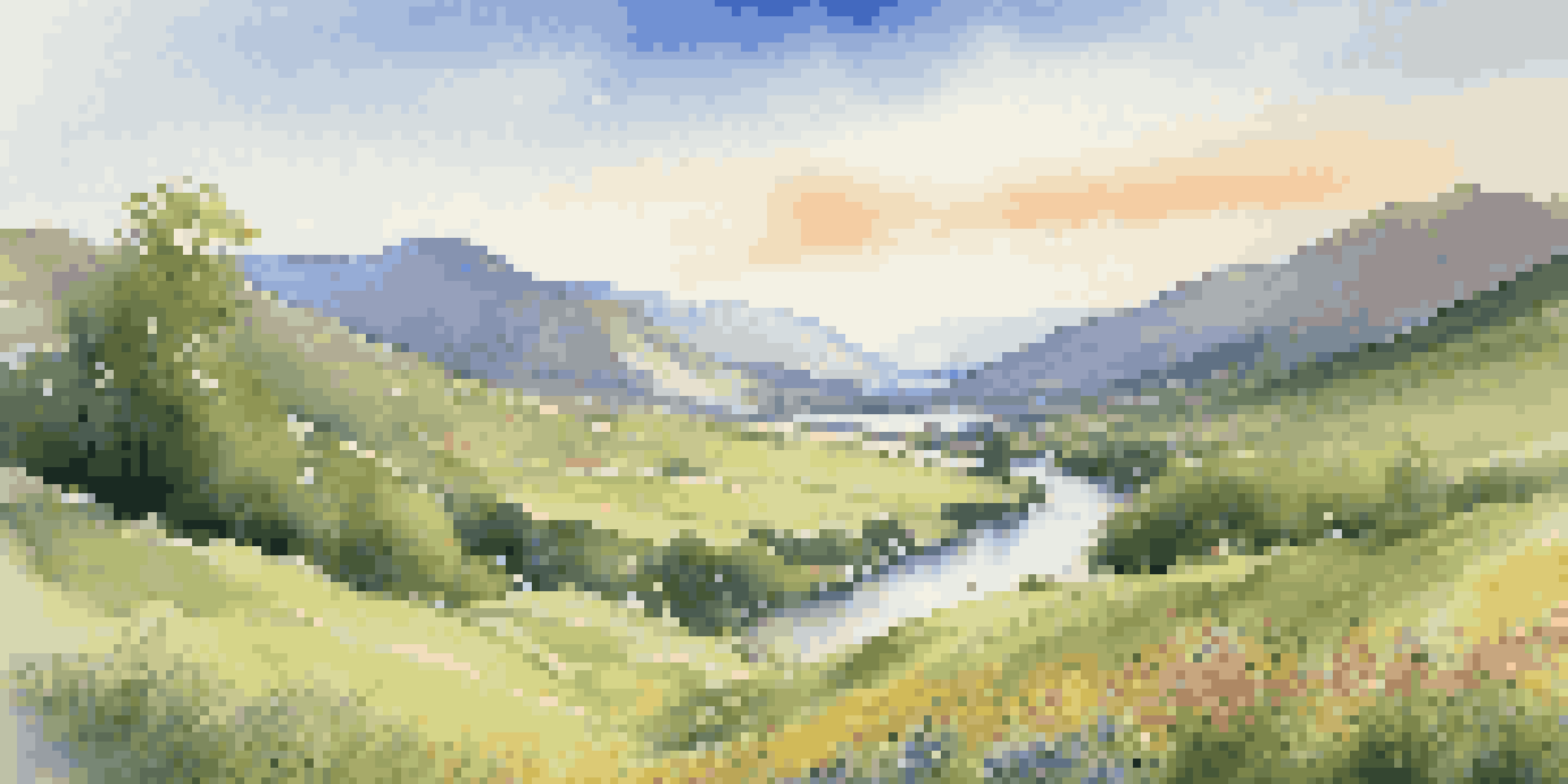 A beautiful green valley with a river and mountains under a clear blue sky.