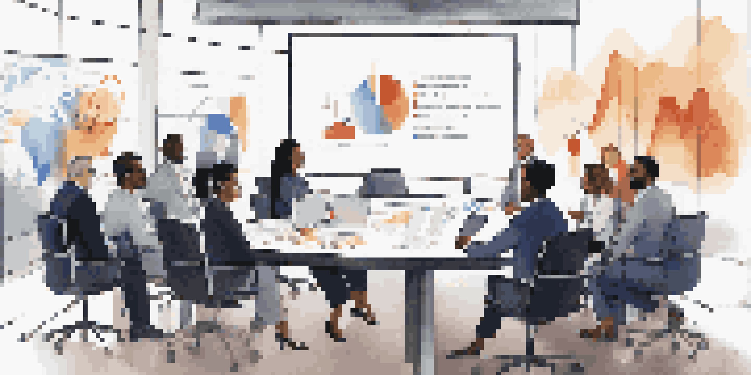 A diverse group of business professionals in a modern conference room, discussing investment strategies with charts on a screen.