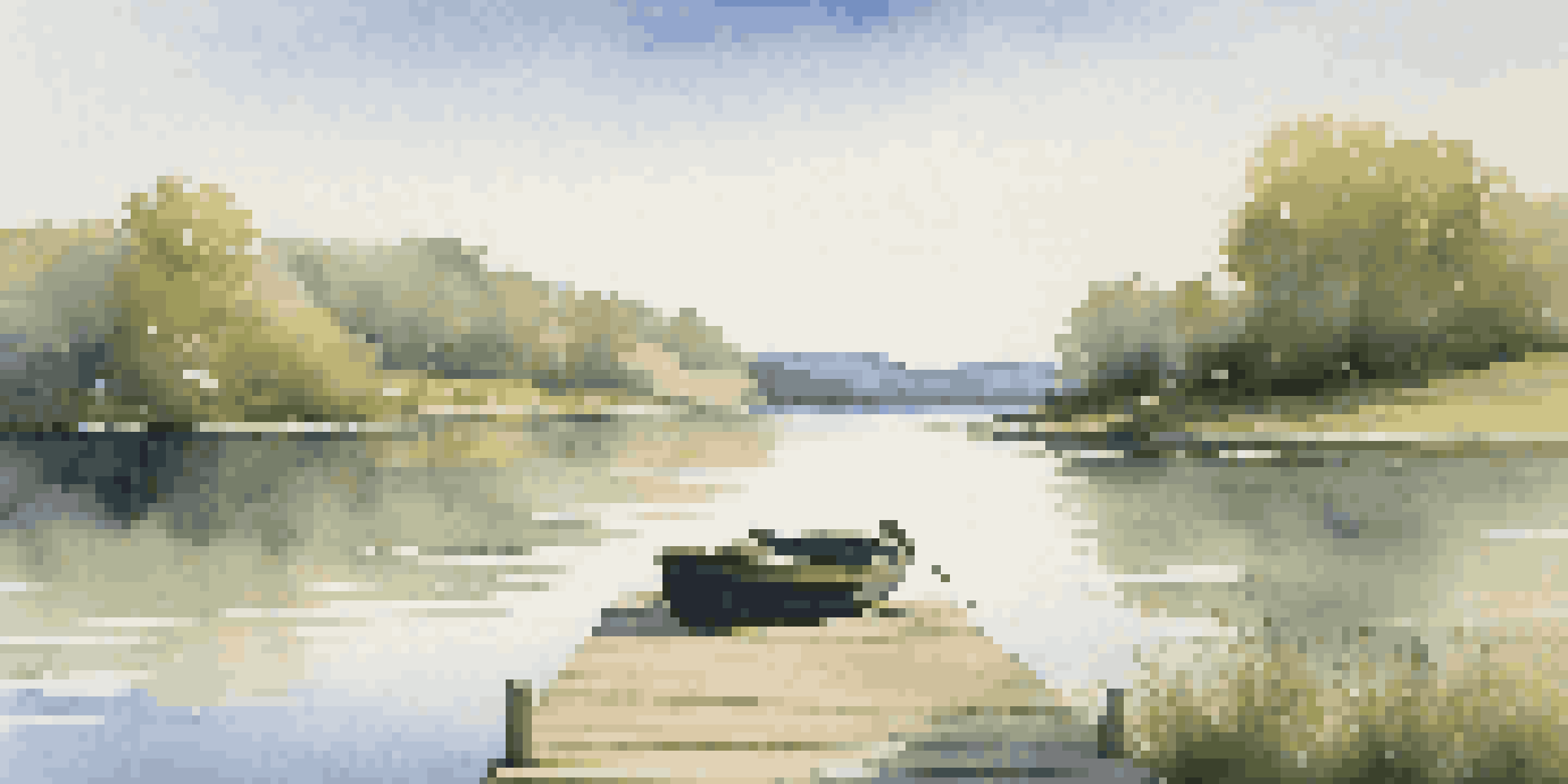 A peaceful lake scene with green hills, a wooden dock, and a small rowboat on the water under a blue sky.