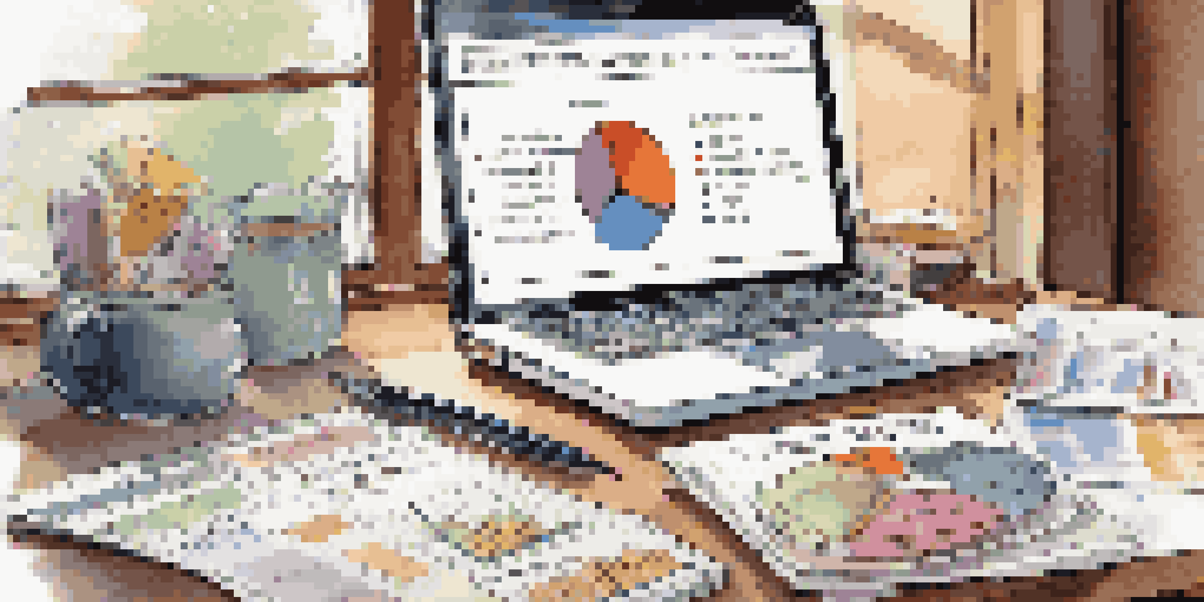 A financial advisor's desk with investment fund brochures, a laptop showing stock market data, and a cup of coffee, illuminated by soft natural light.