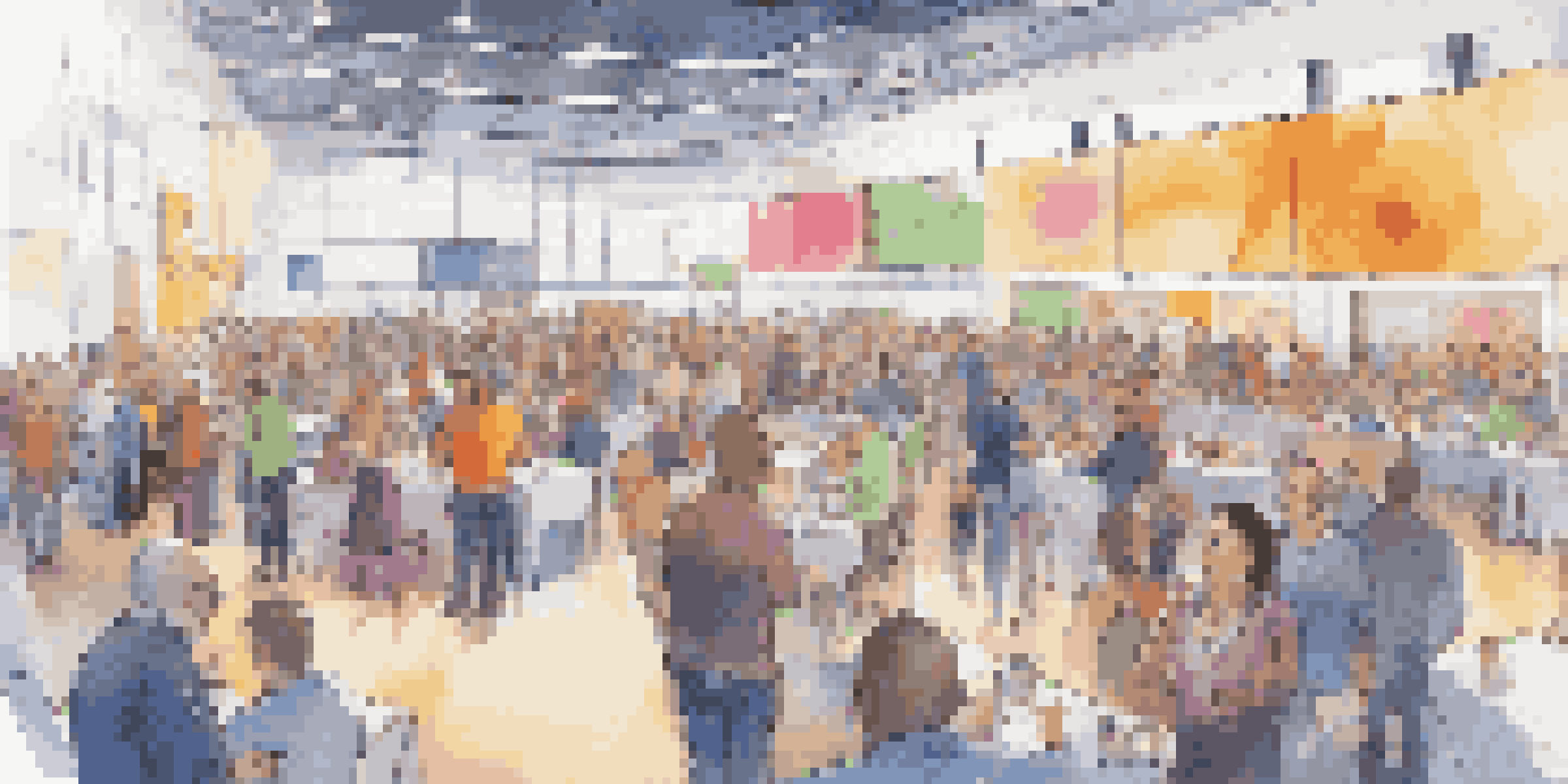 A lively crowdfunding event featuring various entrepreneurs displaying their projects to potential backers in a convention center.