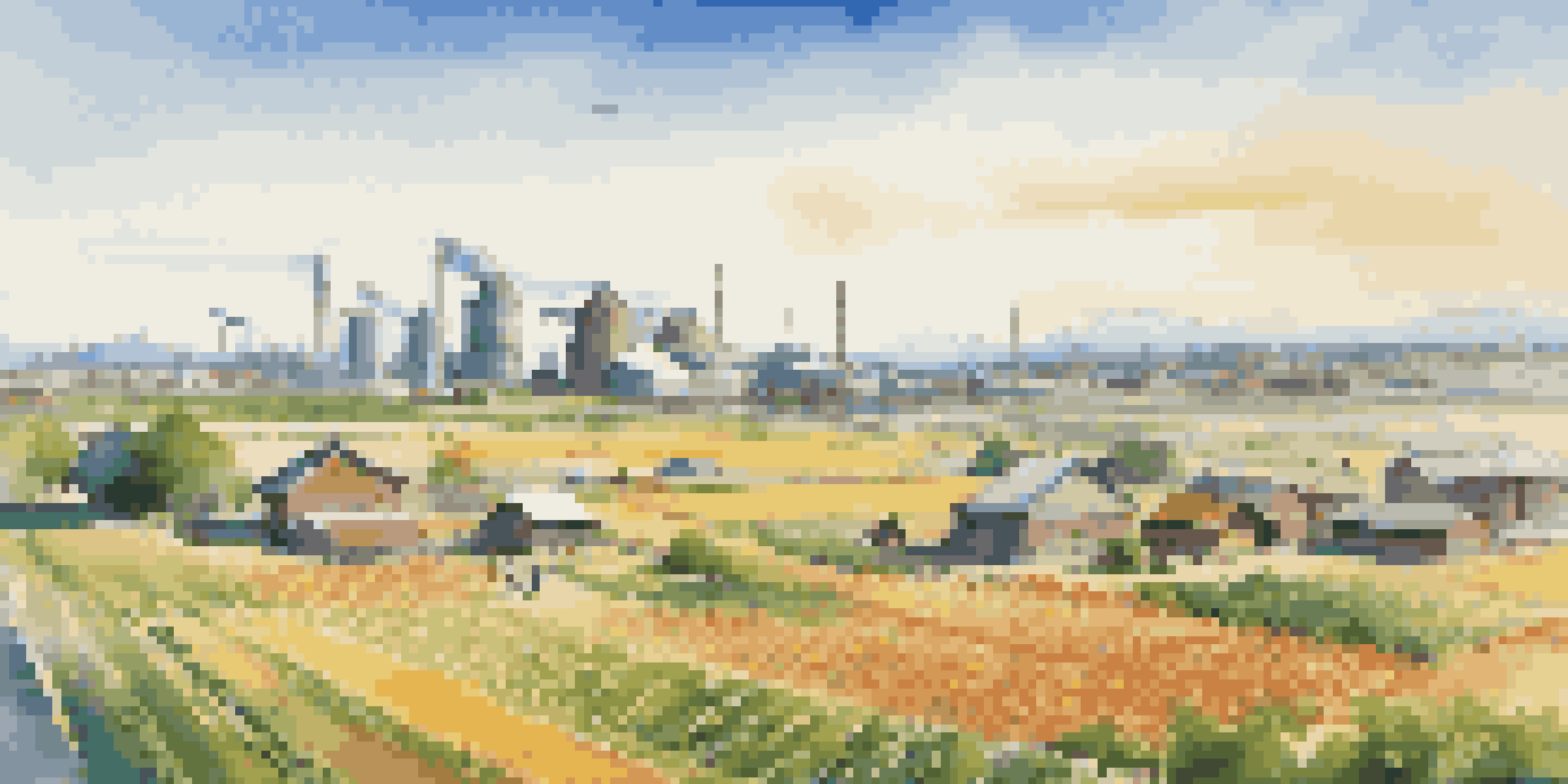 A colorful landscape showing a mix of agriculture, industry, and technology, symbolizing a diversified economy.