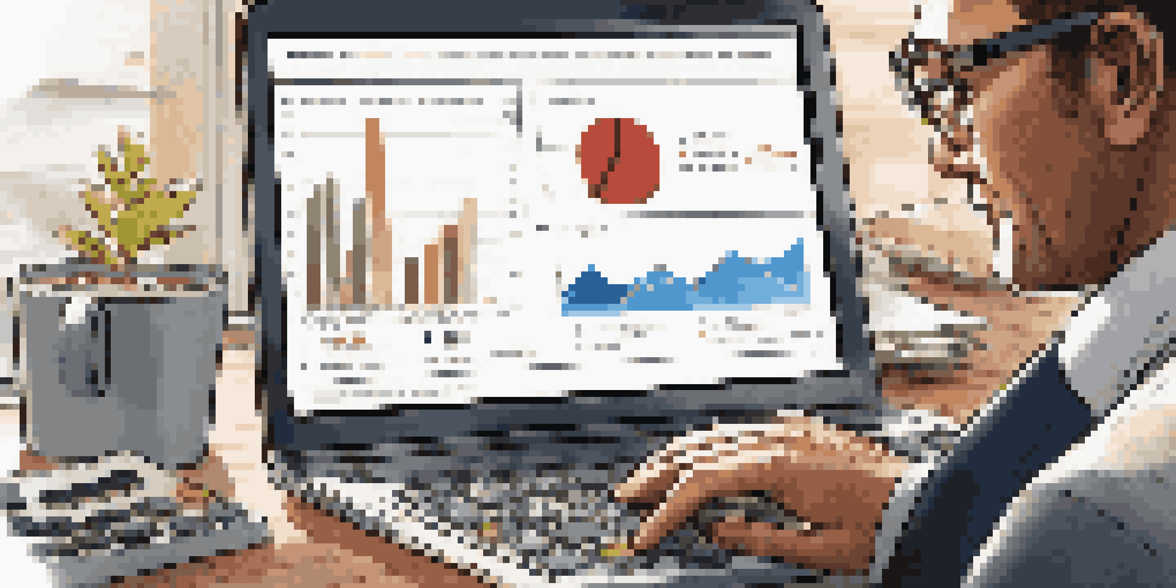 A business professional reviewing cash flow metrics on a laptop in a modern office setting.