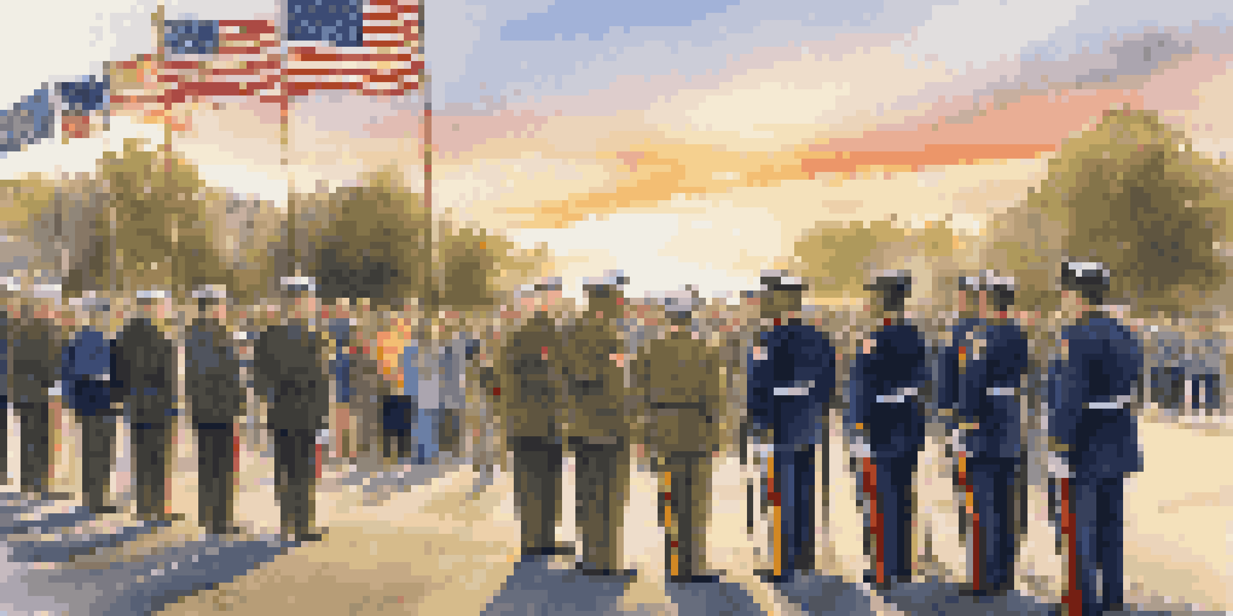 A military retirement ceremony with service members in uniform standing outdoors during sunset, with flags and an audience of family and friends.