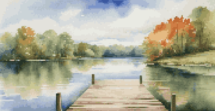 A calm lake surrounded by green trees with a blue sky and a wooden dock extending into the water.