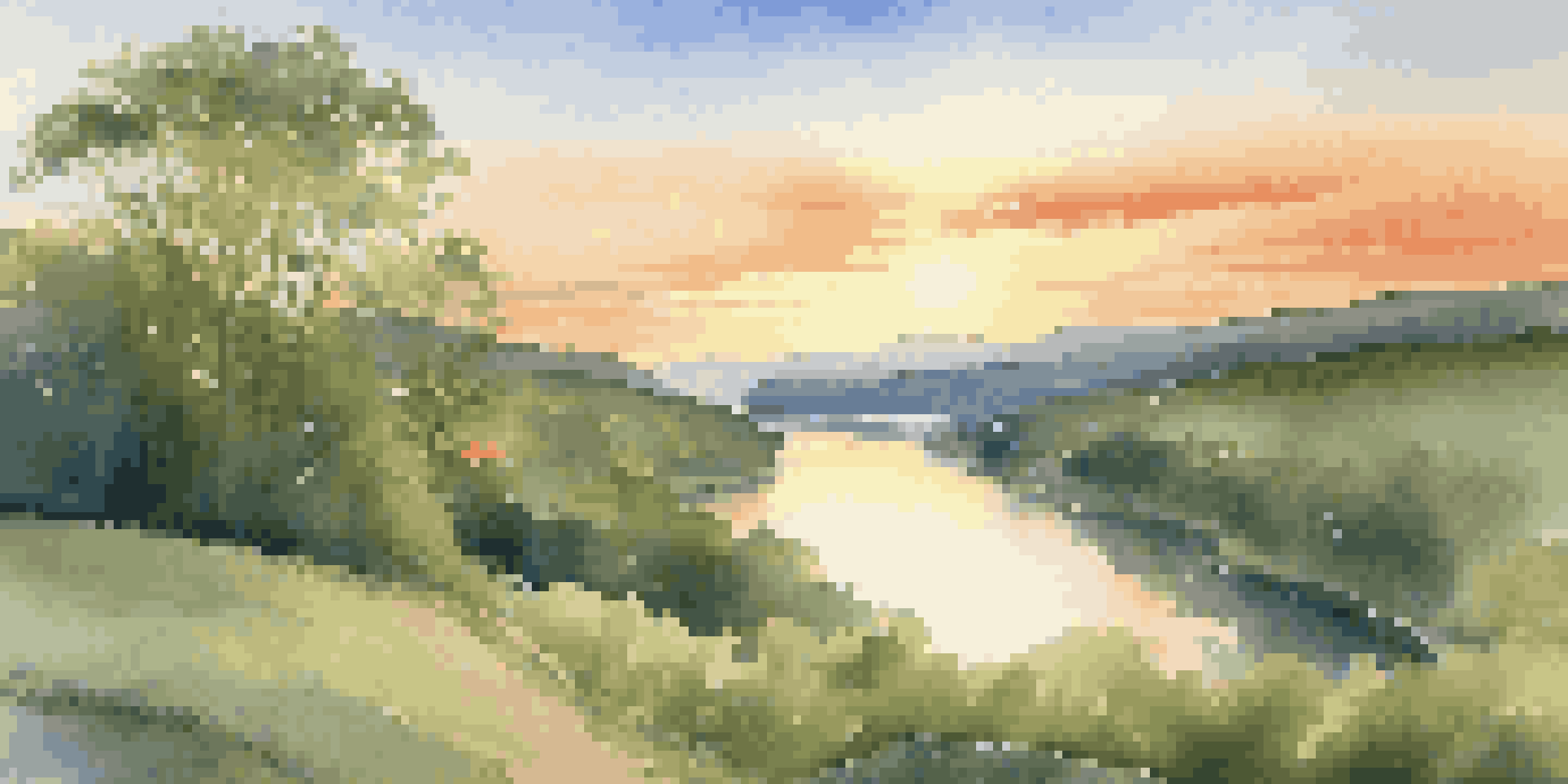 A tranquil valley with a flowing river and colorful trees under a clear sky during sunset.