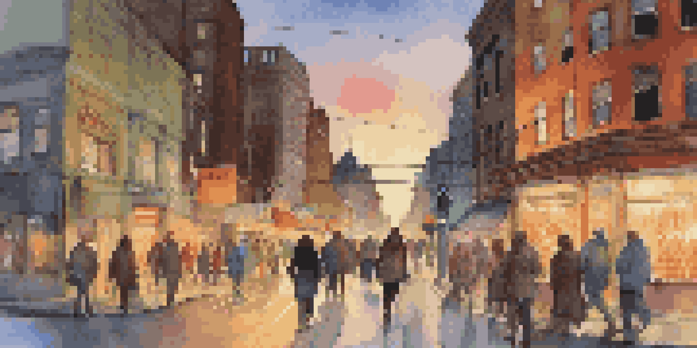 A busy city street at dusk with lights and people.