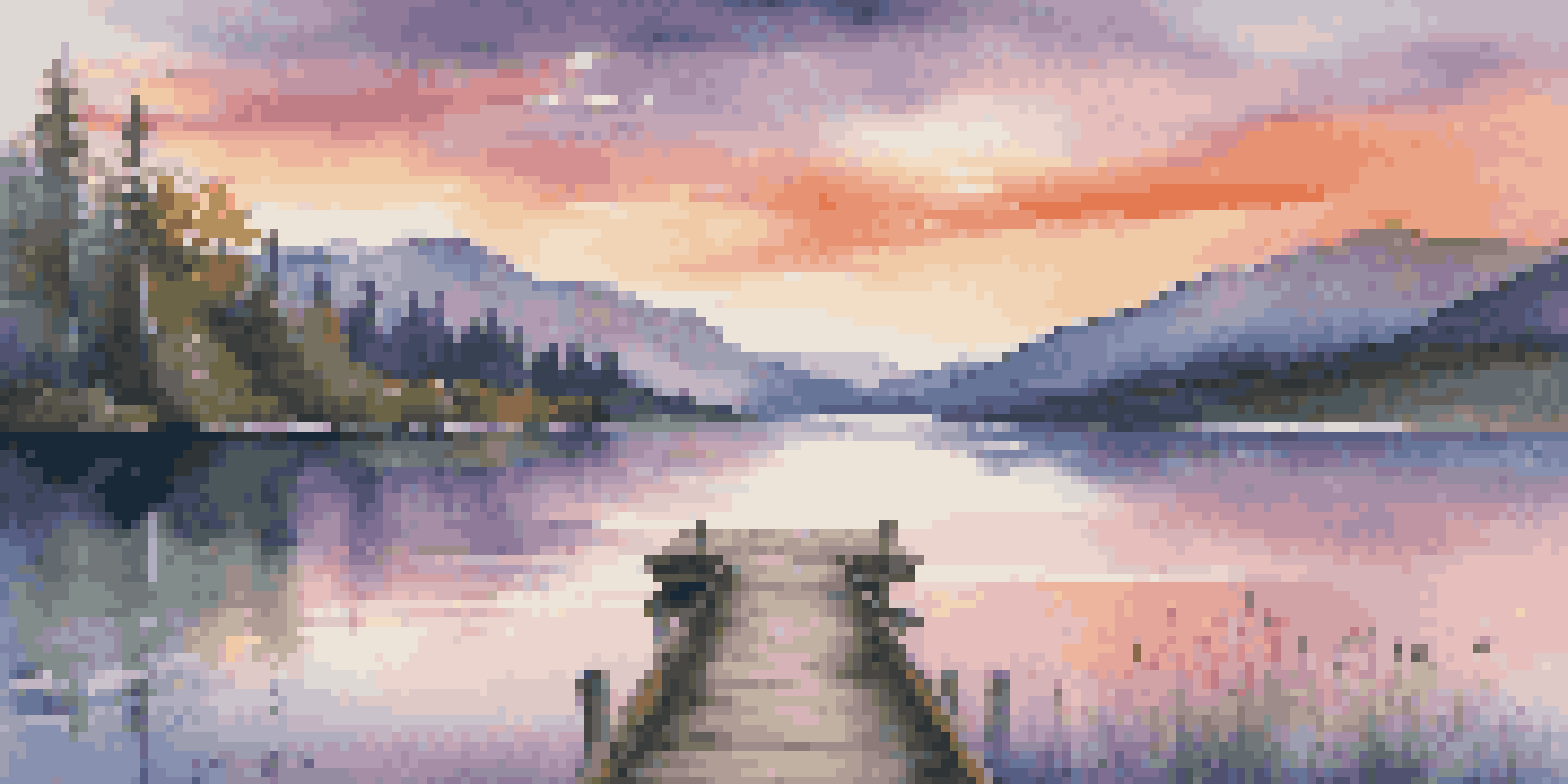A peaceful sunset over a calm lake surrounded by mountains and trees, with colorful reflections in the water.
