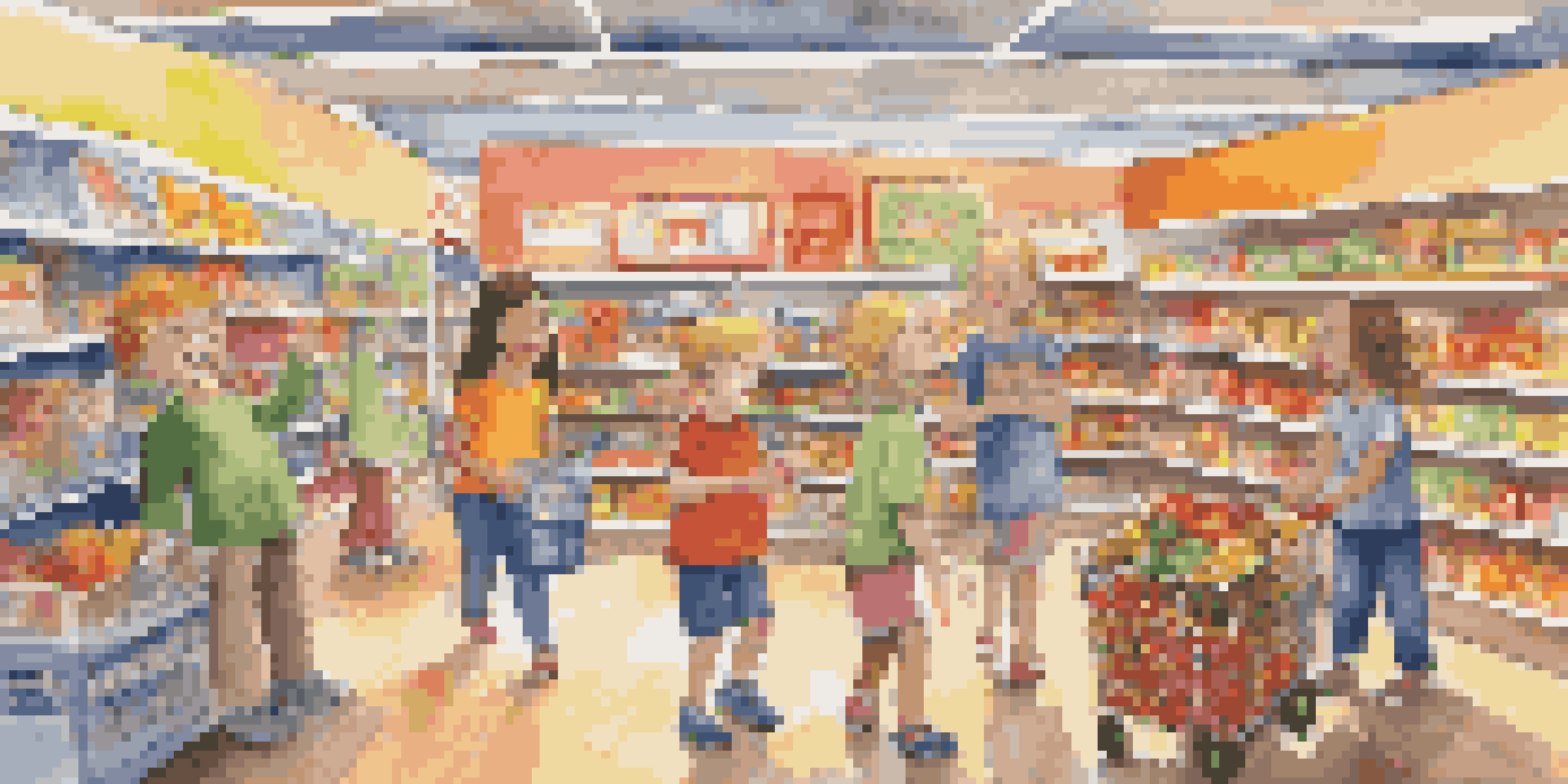 A colorful mock grocery store where children are role-playing as customers and a cashier, surrounded by grocery items and play money.