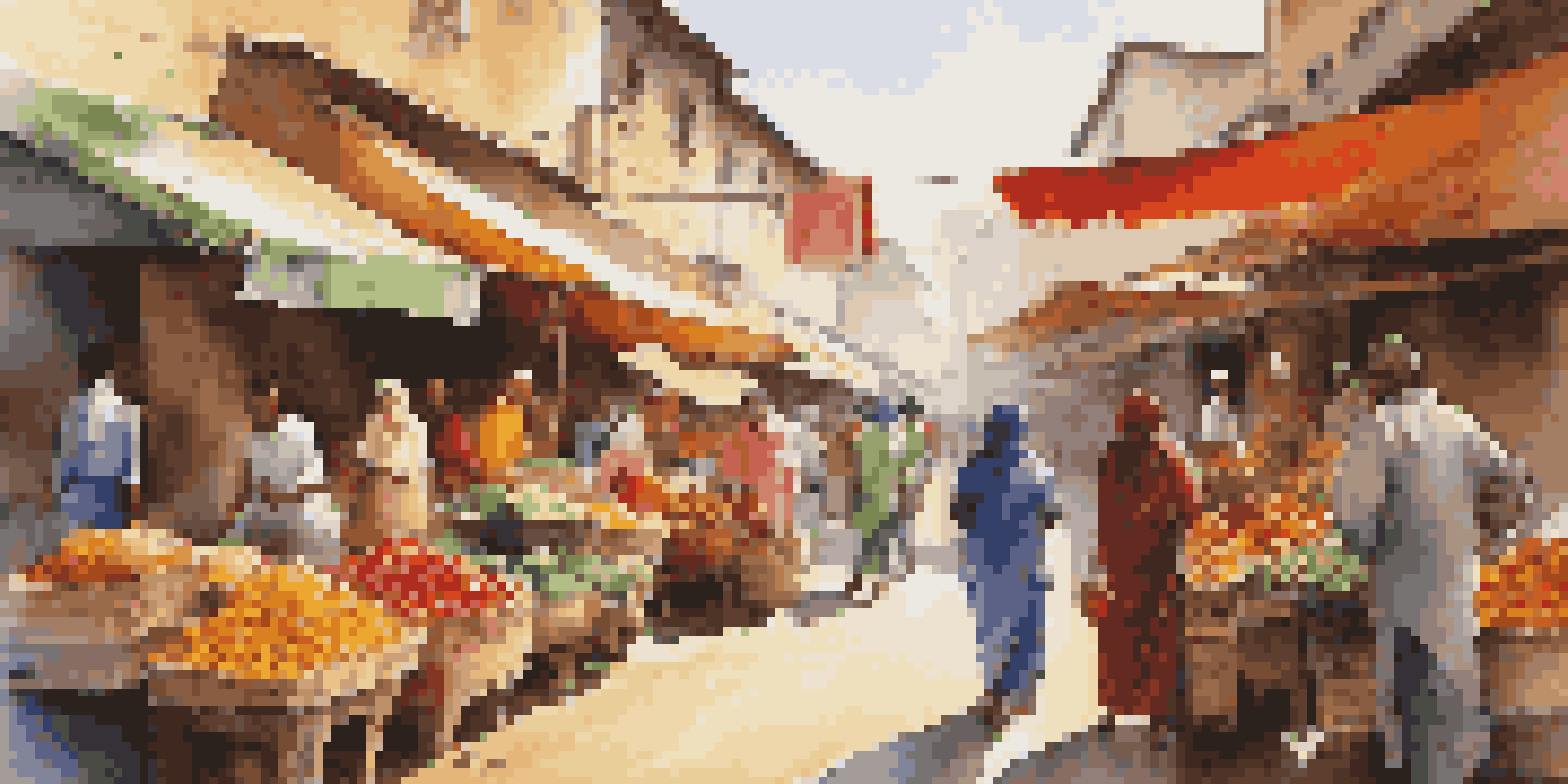 A busy street market in an emerging market with colorful stalls and people shopping.